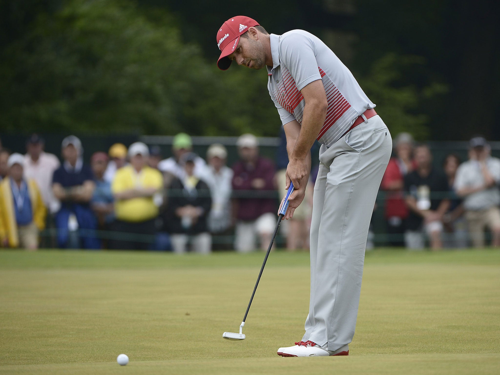 Sergio Garcia on the way to a double-bogey on the 14th hole. The Spaniard needed uniformed officials to protect him from the crowd after his comments about Tiger Woods