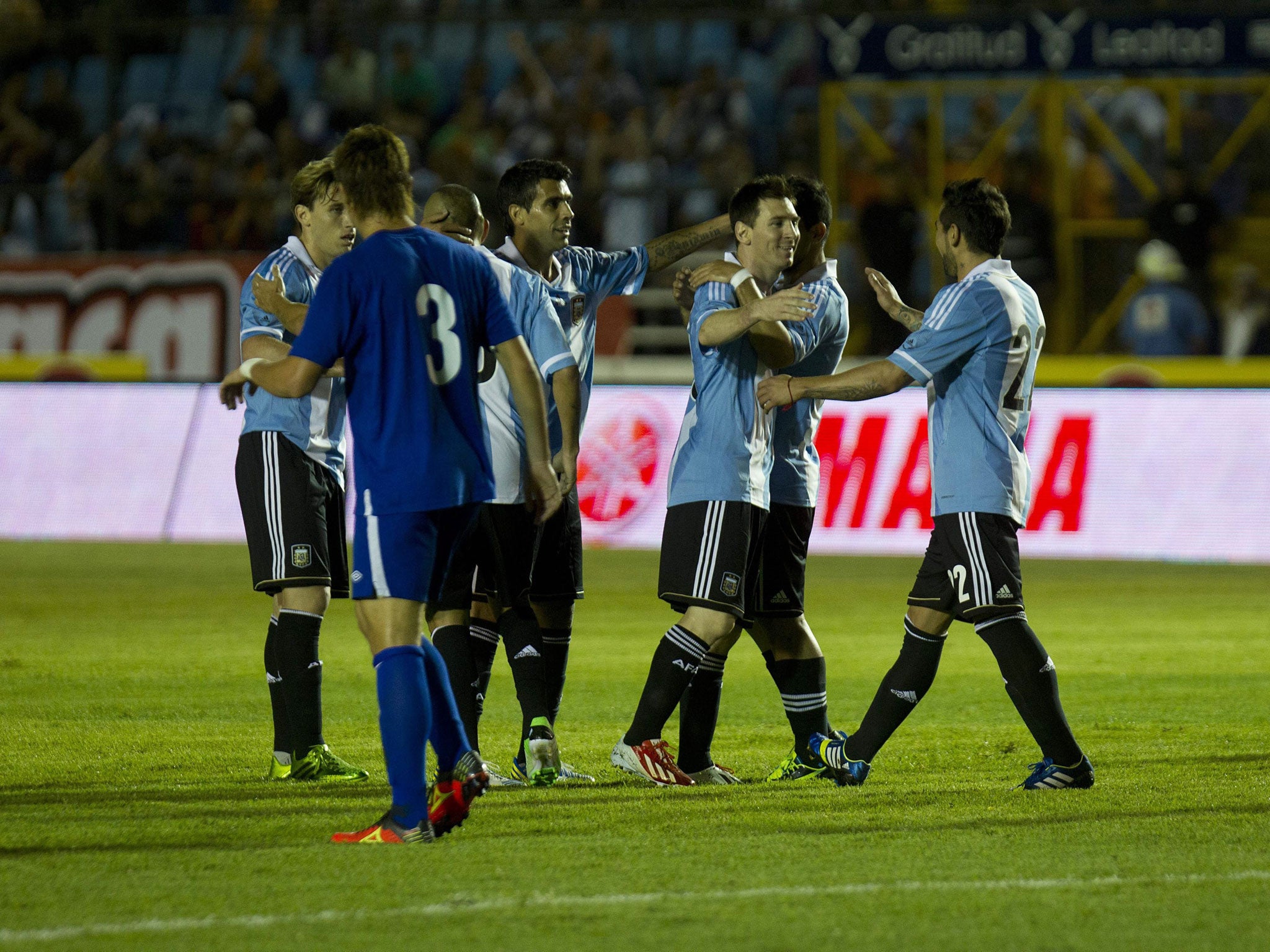 Lionel flair: The Argentinian celebrates with teammates