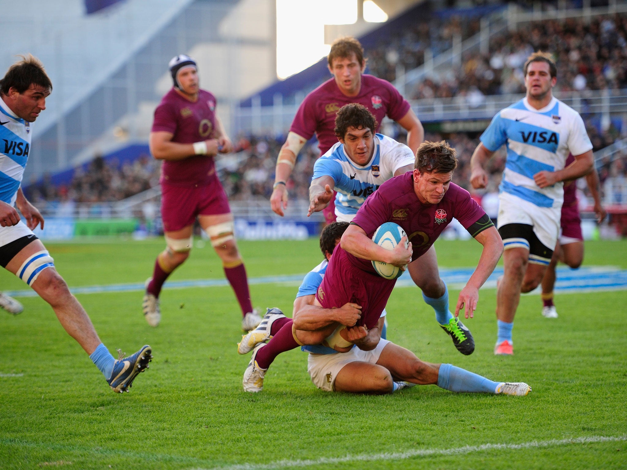 Firepower: Outside-half Freddie Burns crosses the line for one of England's seven tries in the Second Test against Argentina in Buenos Aires