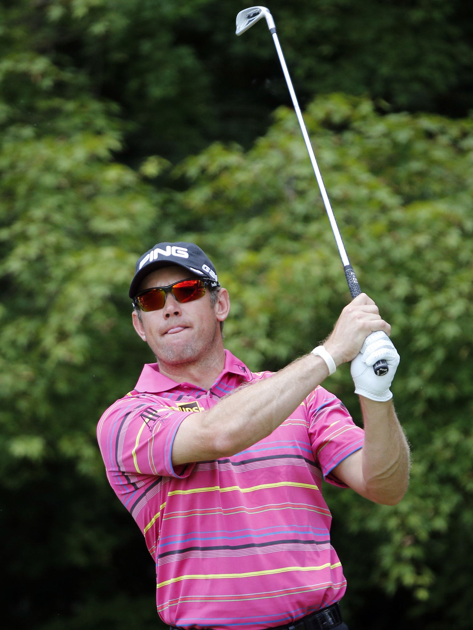 Eye full: Lee Westwood watches his tee shot at the second