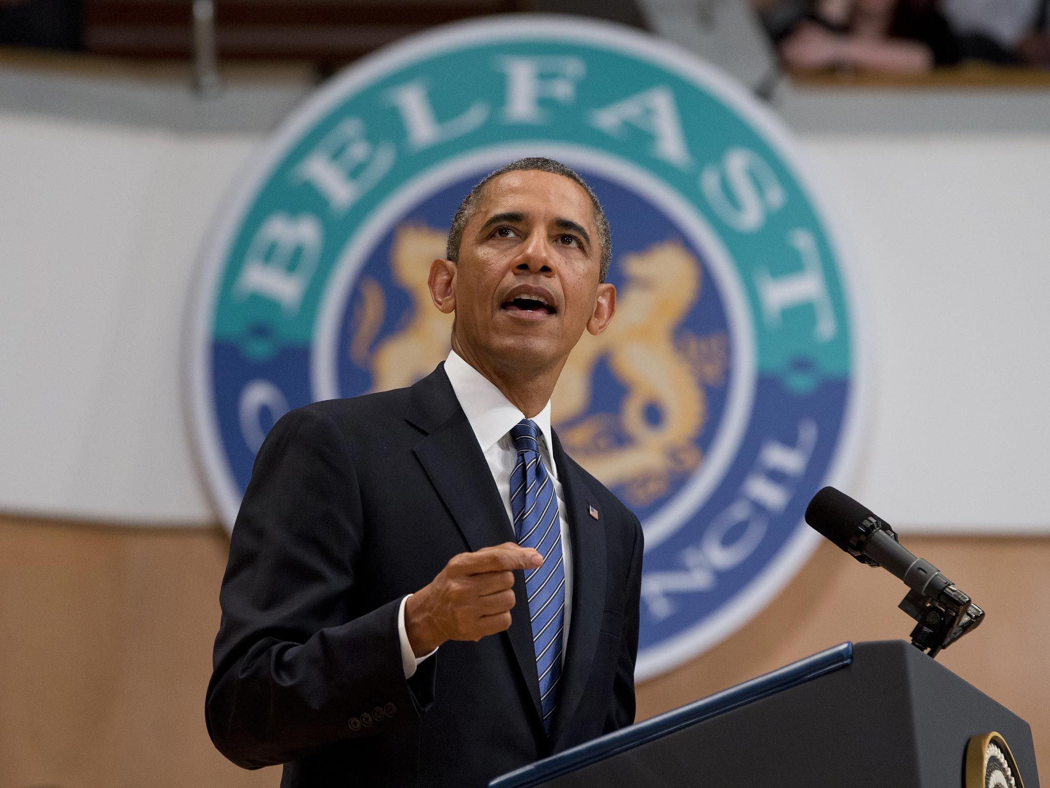 U.S. President Barack Obama gestures during a speech at the Belfast Waterfront Hall