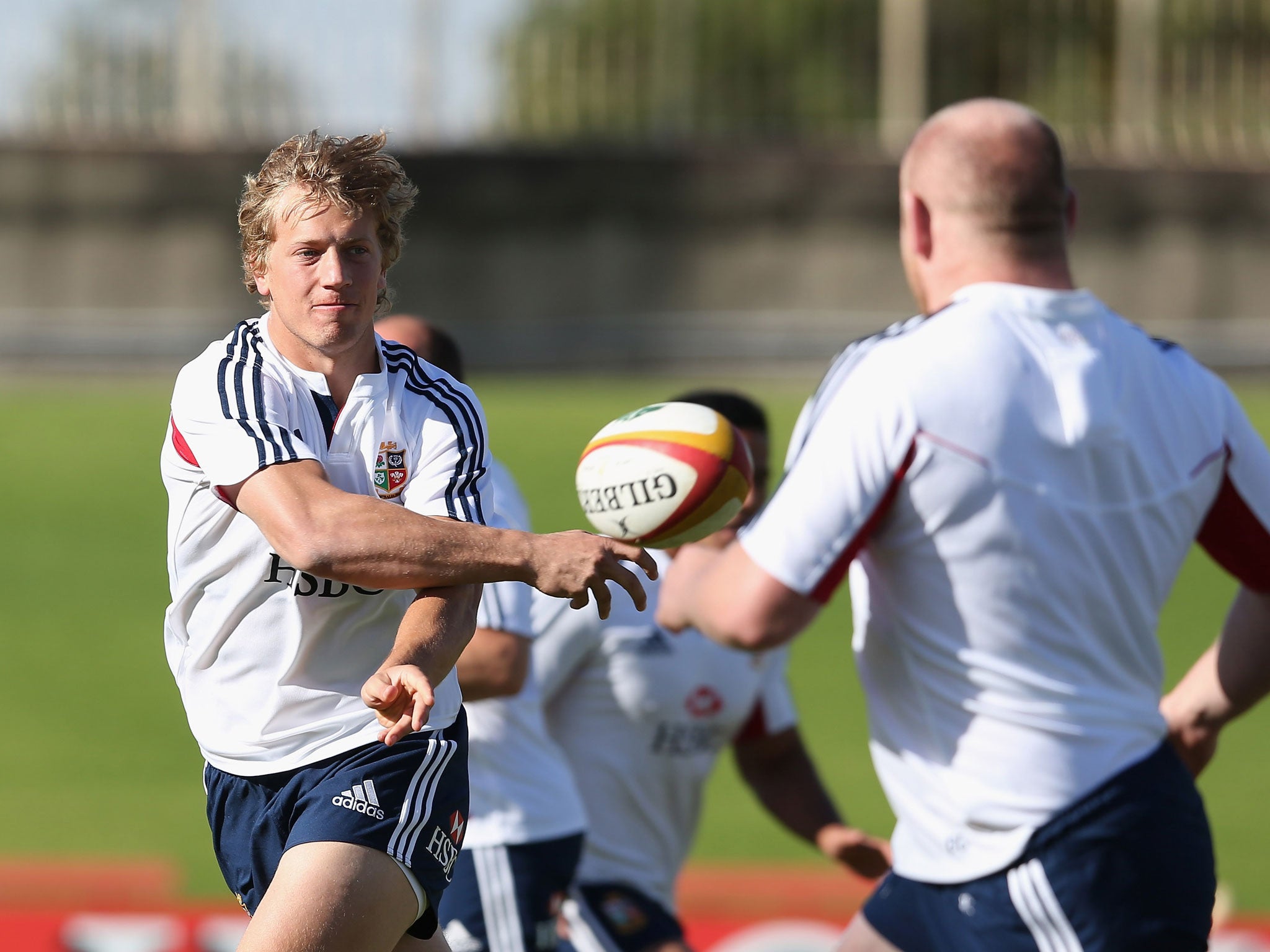 Billy Twelvetrees passes the ball during a Lions training session