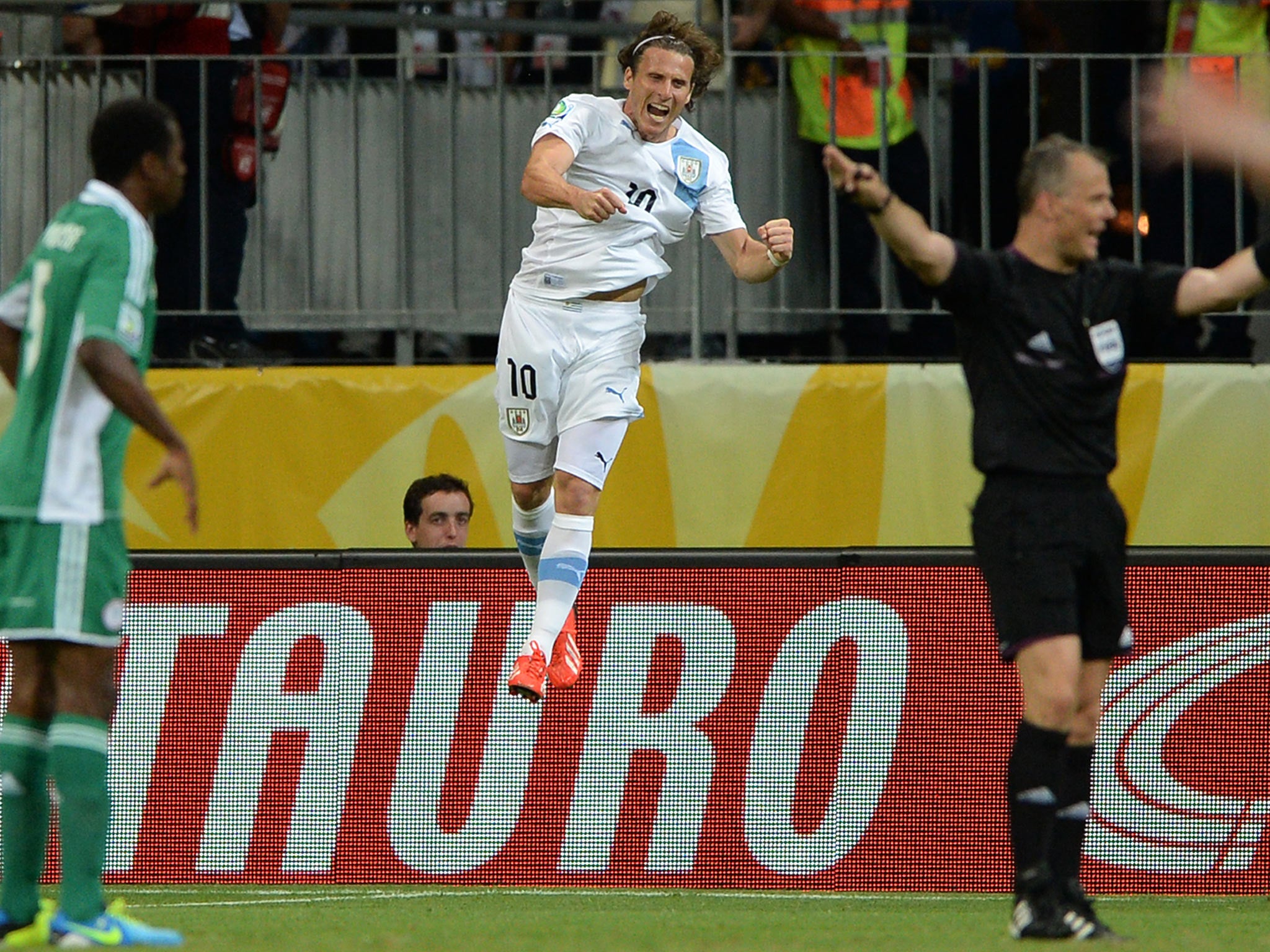 Diego Forlan celebrates his goal against Nigeria