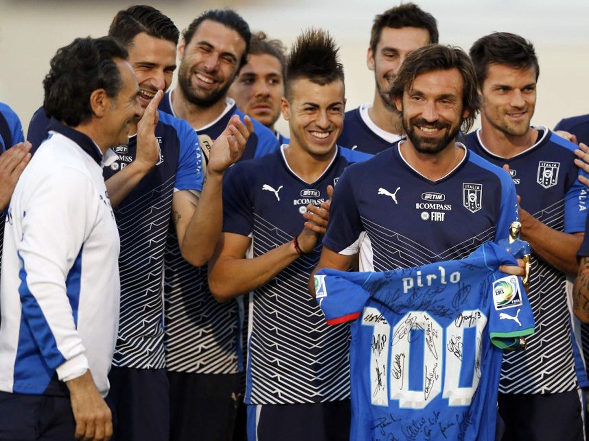 Andrea Pirlo, who won his 100th cap for Italy last week, is presented with a shirt signed by all his Azzurri team-mates