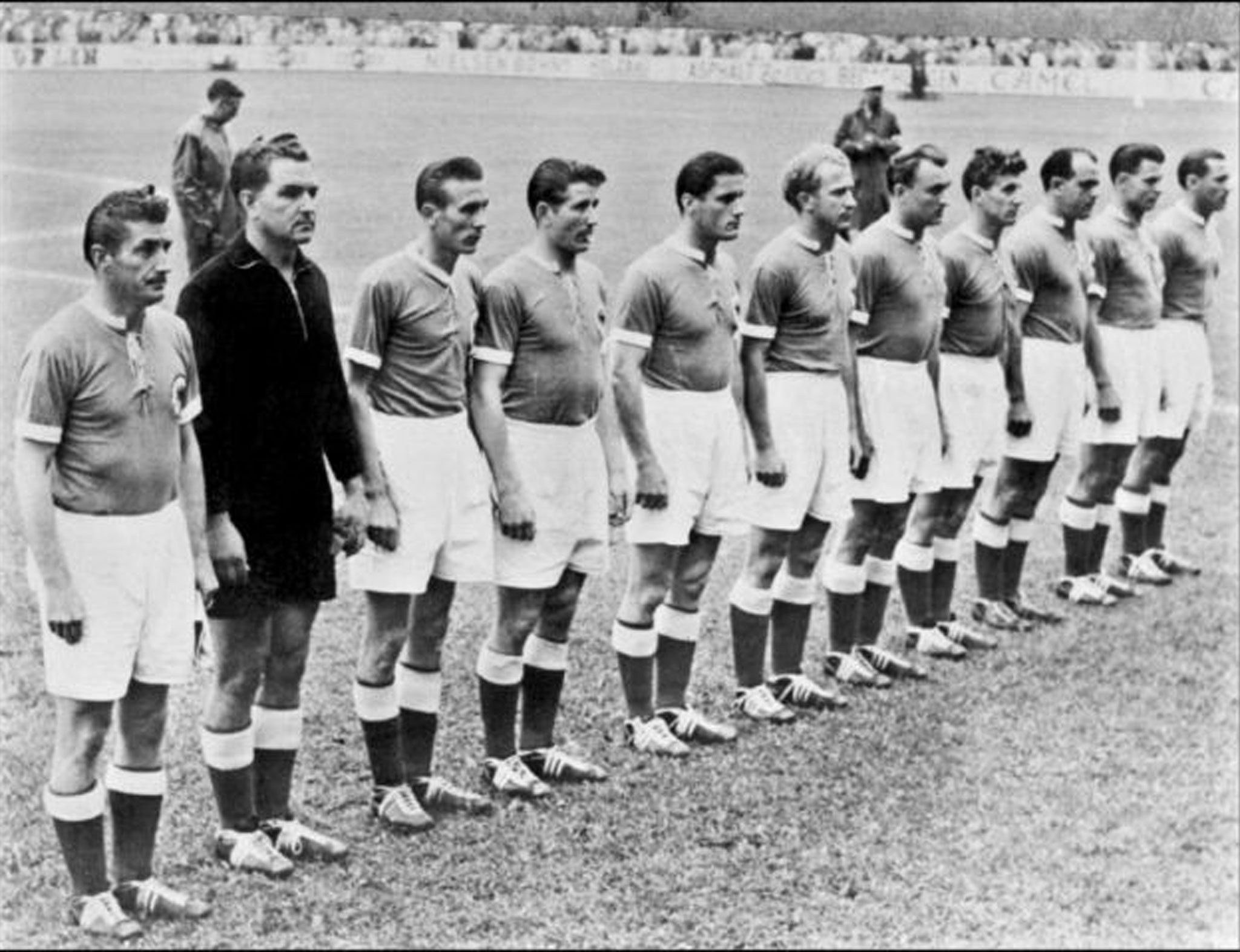 Walter, fifth from left, with the West Germany team in 1954, and below, with a picture of his old self at a ceremony in 2004 to mark the 50th anniversary of his side’s famous victory