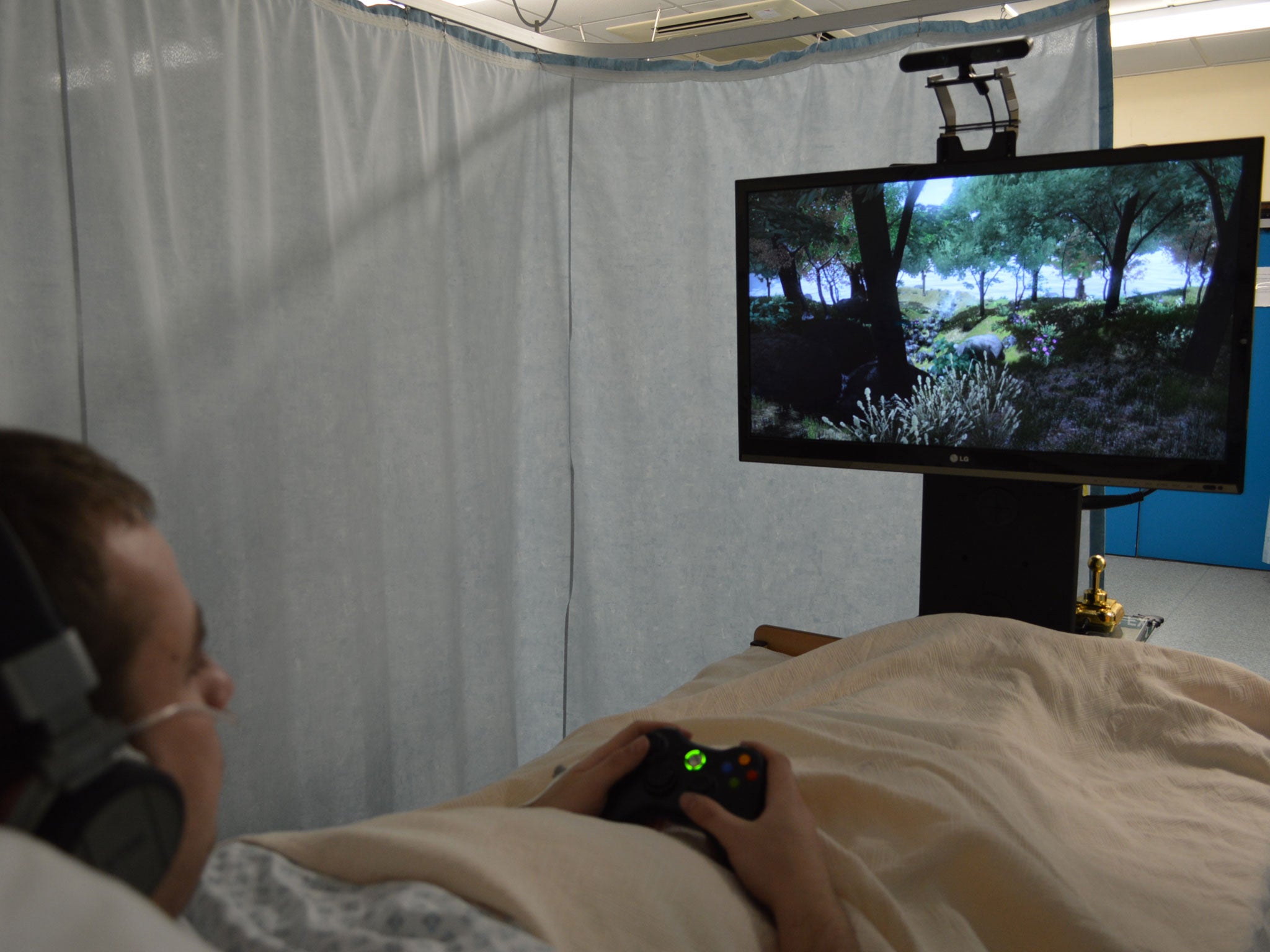 A patient watches a relaxing virtual-reality scene while receiving pioneering pain-relief treatment