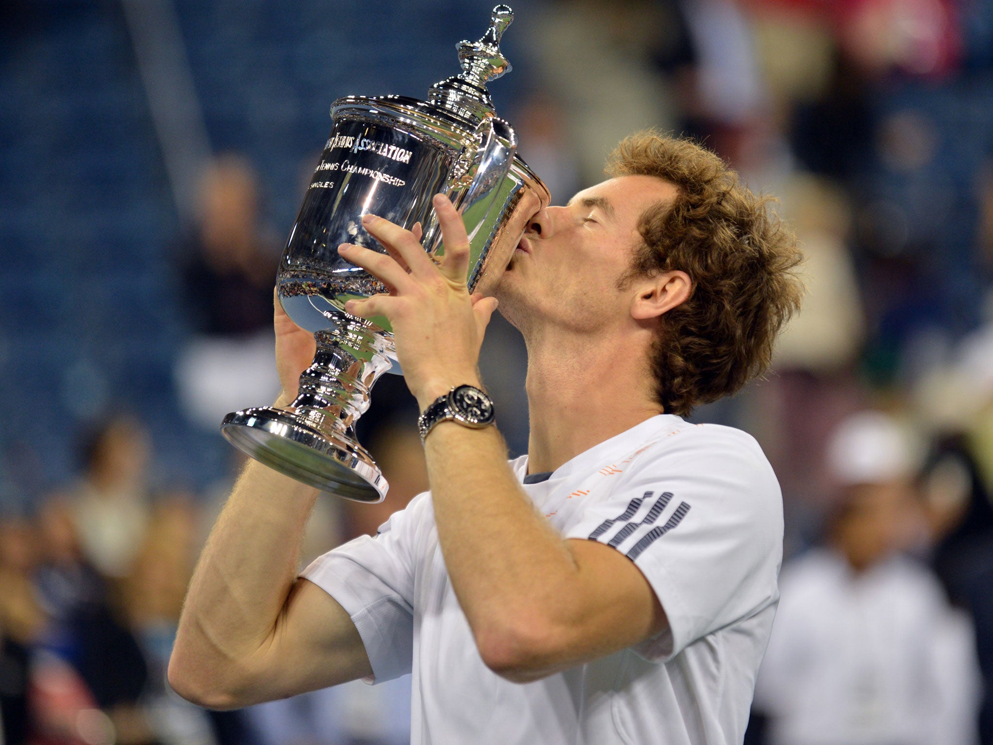 Andy Murray of Britain kisses the trophy after his win over Novak Djokovic