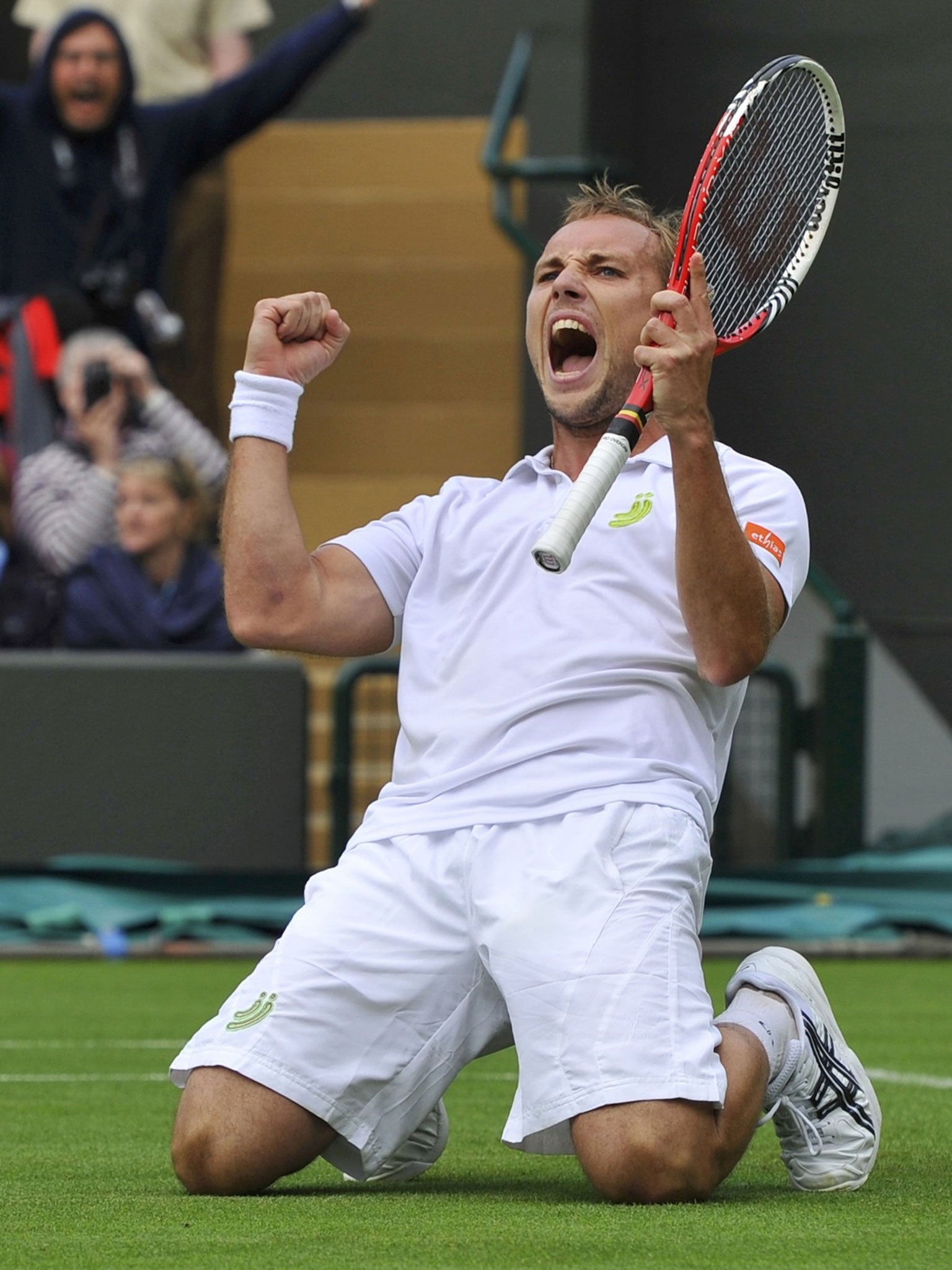 Steve Darcis celebrates beating Rafael Nadal