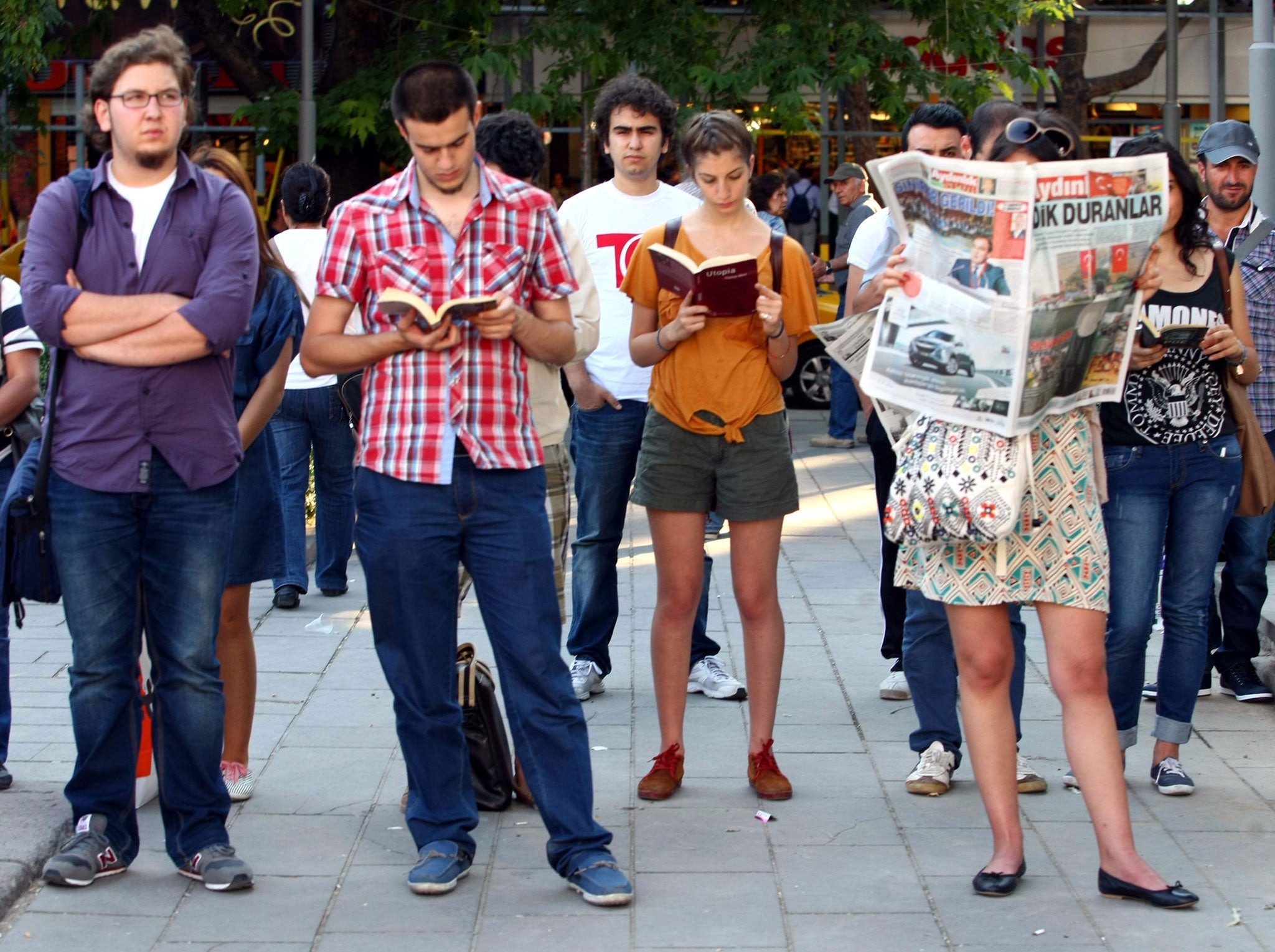 Turkish protesters stand in Red Crescent square during a 'duranadam' (standing person) protest in Ankara on June 19 2013. Riot police on Wednesday clashed briefly with groups of anti-government protesters in two Turkish cities, but there was no fresh unrest in Istanbul where demonstrators switched to silent protests after a heavy crackdown.