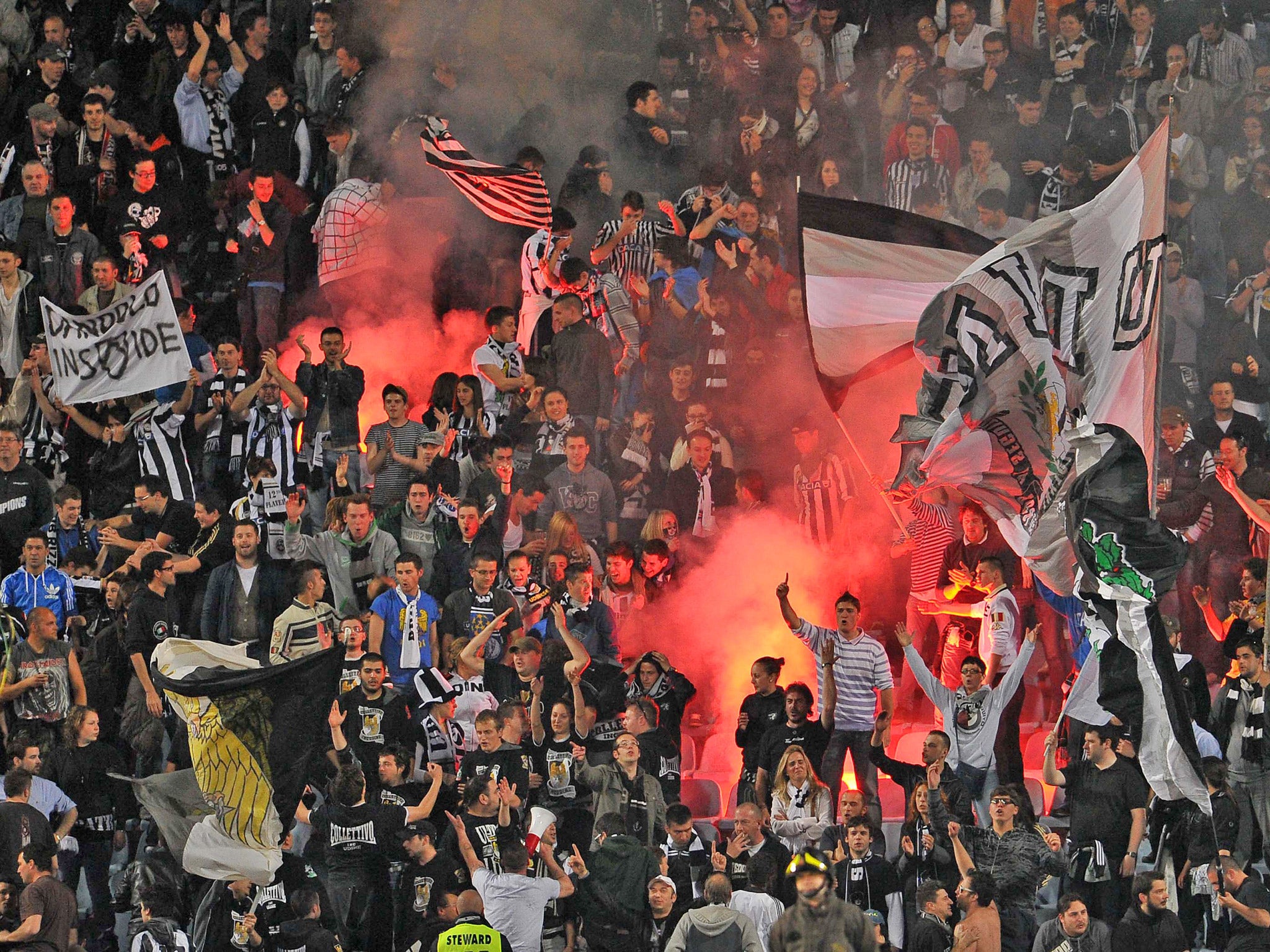 Udinese's fans at the Friuli Stadium. Udinese were one of the 18 Serie A clubs raided