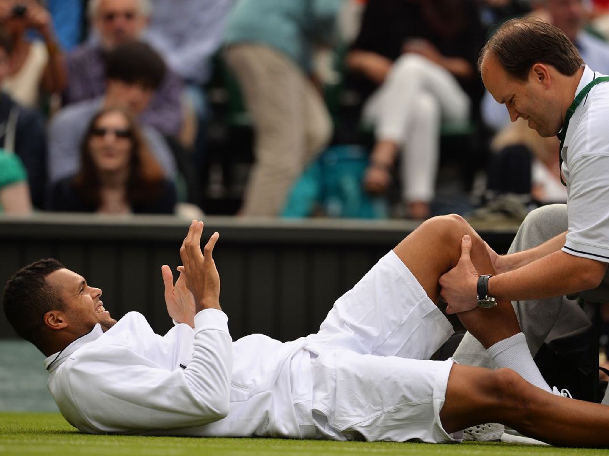 French sixth seed Jo-Wilfried Tsonga retires due to injury during his Wimbledon second-round match against Latvian Ernests Gulbis