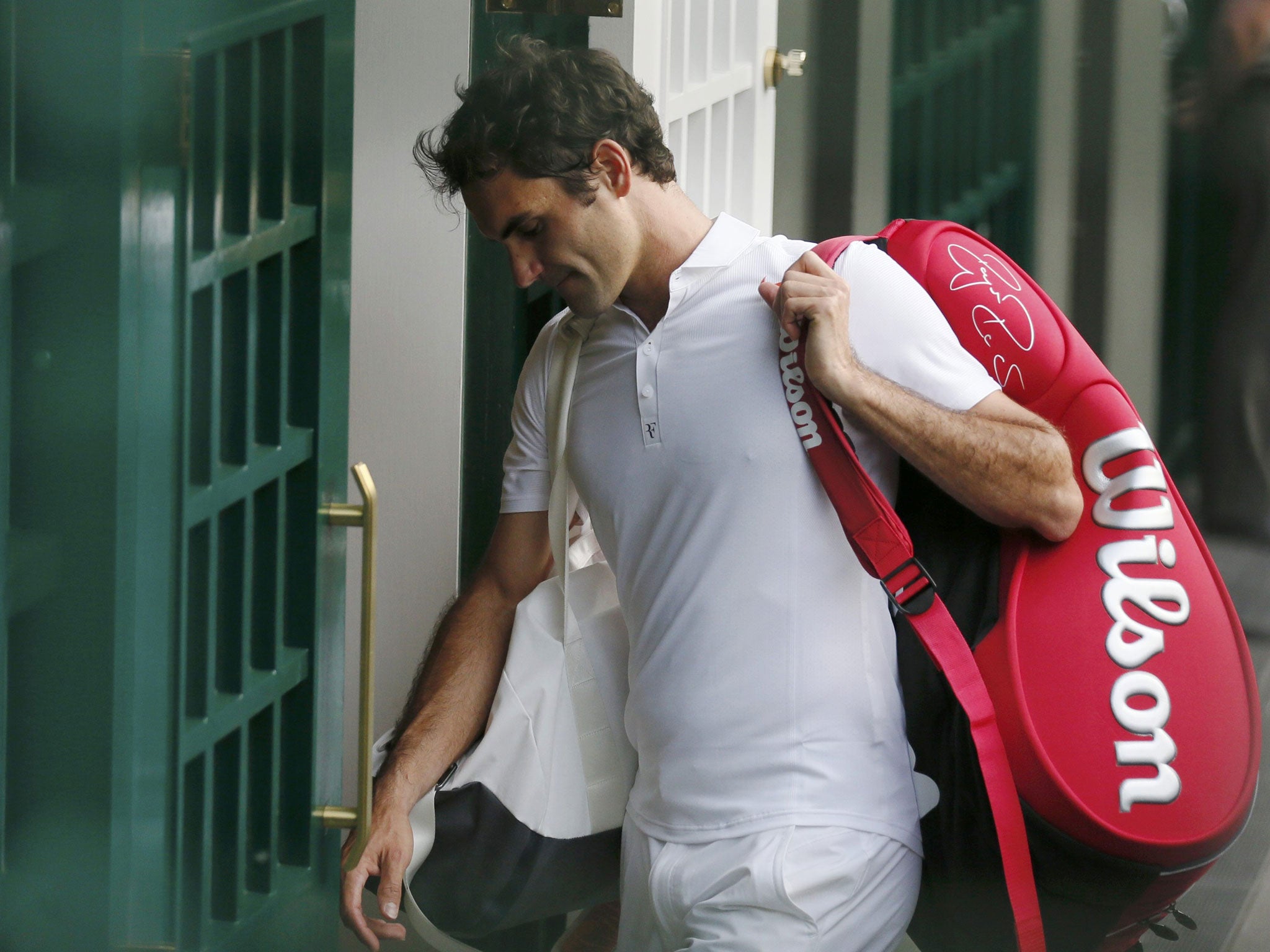 Roger Federer heads for the Wimbledon exit