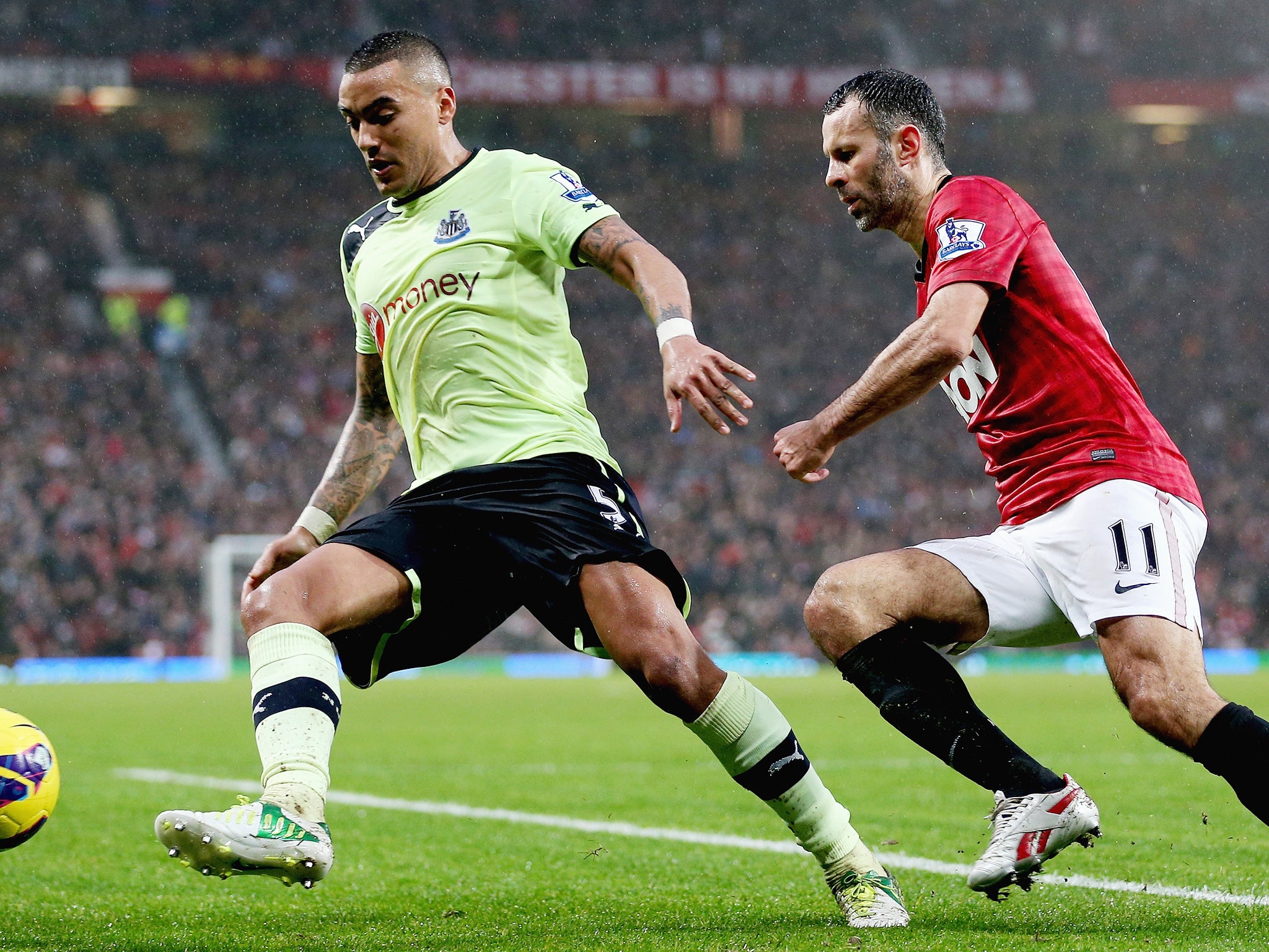 Moving on: Danny Simpson as a Newcastle United player - with Ryan Giggs of Manchester United hot on his heels