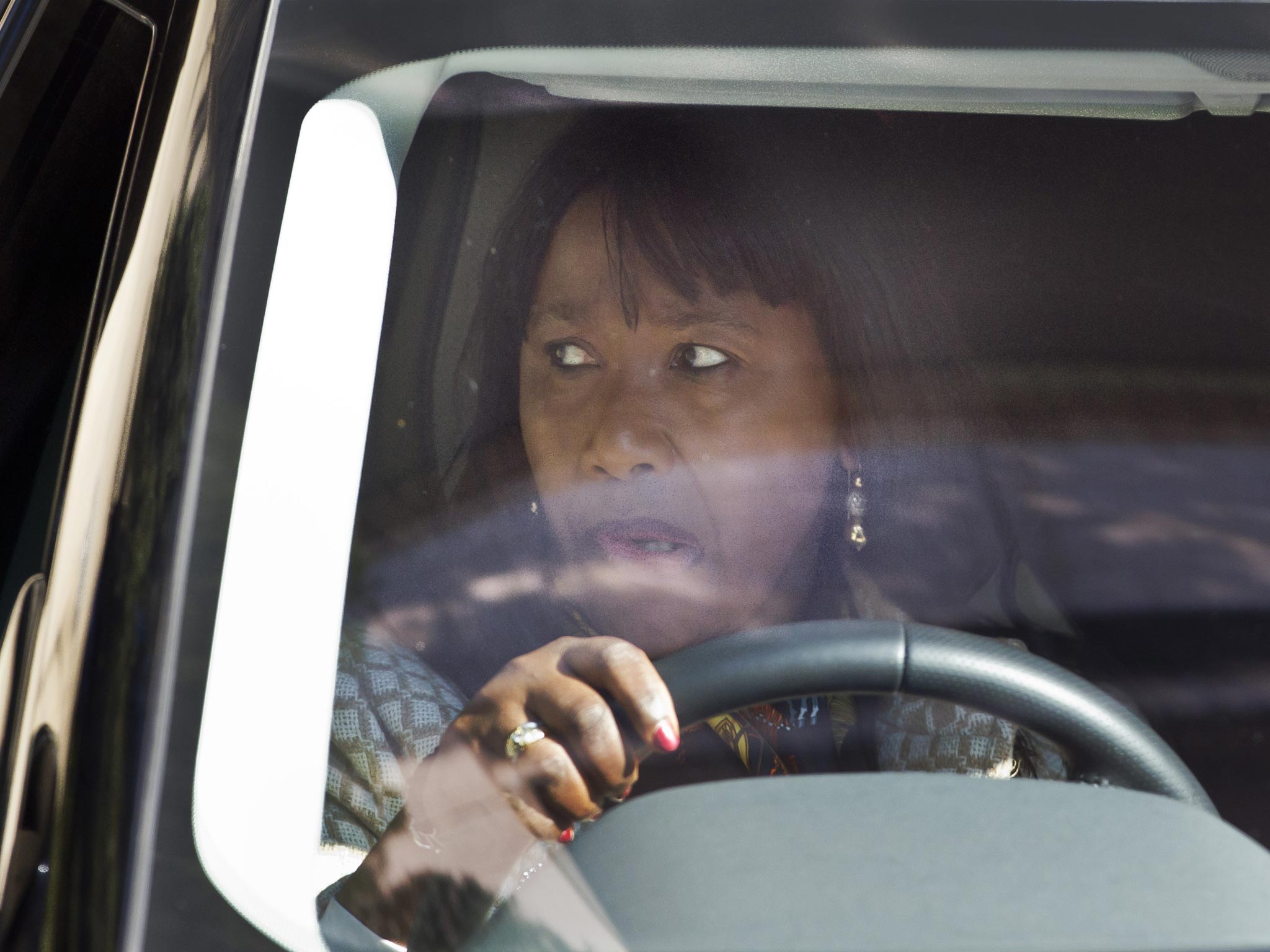 Makaziwe Mandela leaves after visiting the hospital where Nelson Mandela is being treated in Pretoria