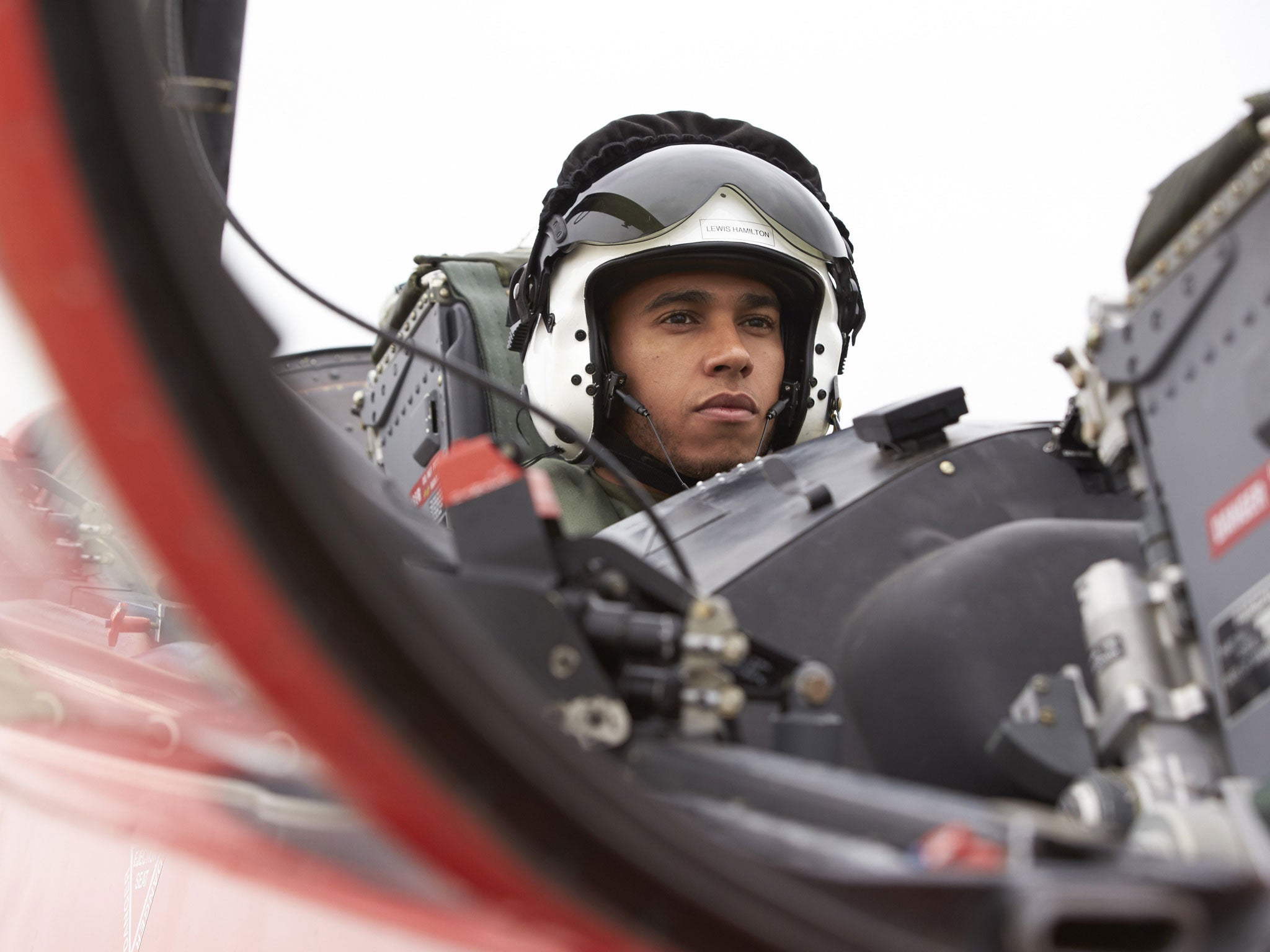 Lewis Hamilton enjoys the high life with the Red Arrows yesterday, but he is hoping to take the chequered flag for the Silver Arrows