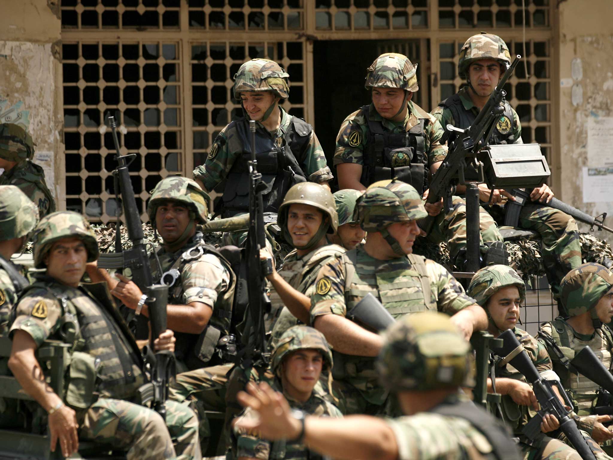 Lebanese army commandos sit on the back of a truck in the Abra district of the southern city of Sidon