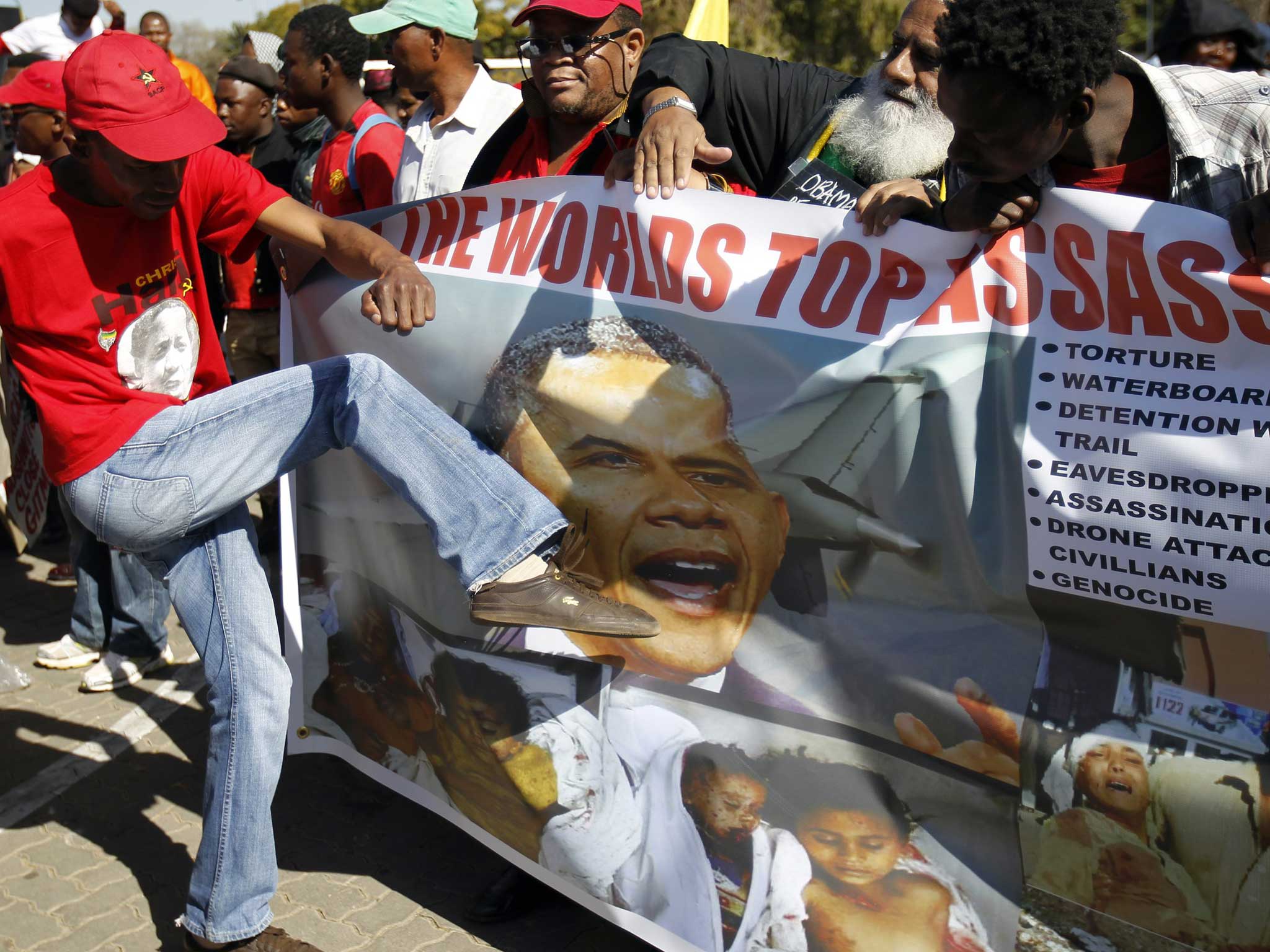 South African protesters campaign against President Barack Obama’s three-nation tour of the continent