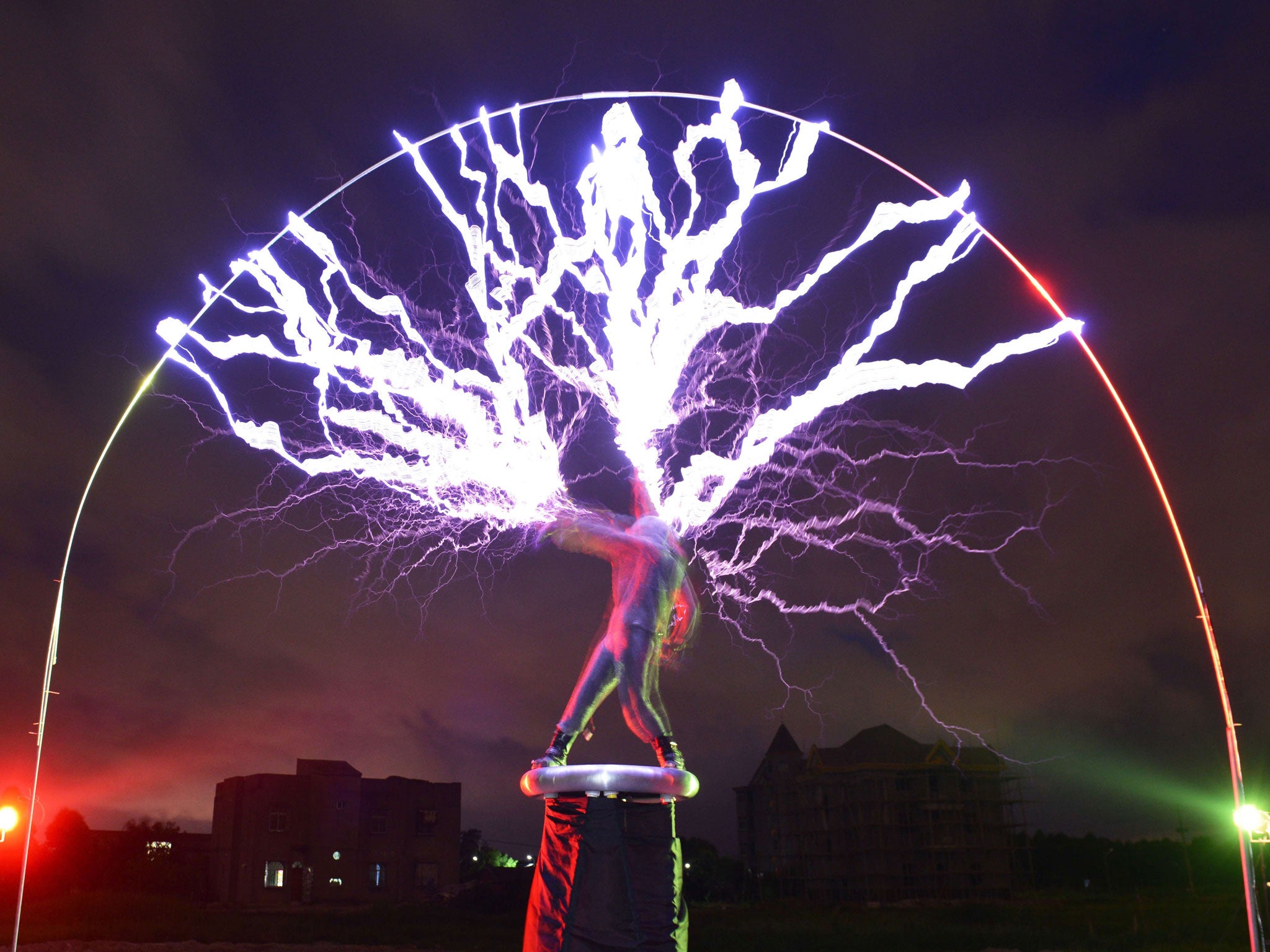 Guitarist Wang Hongbin performing on the Tesla Coil
