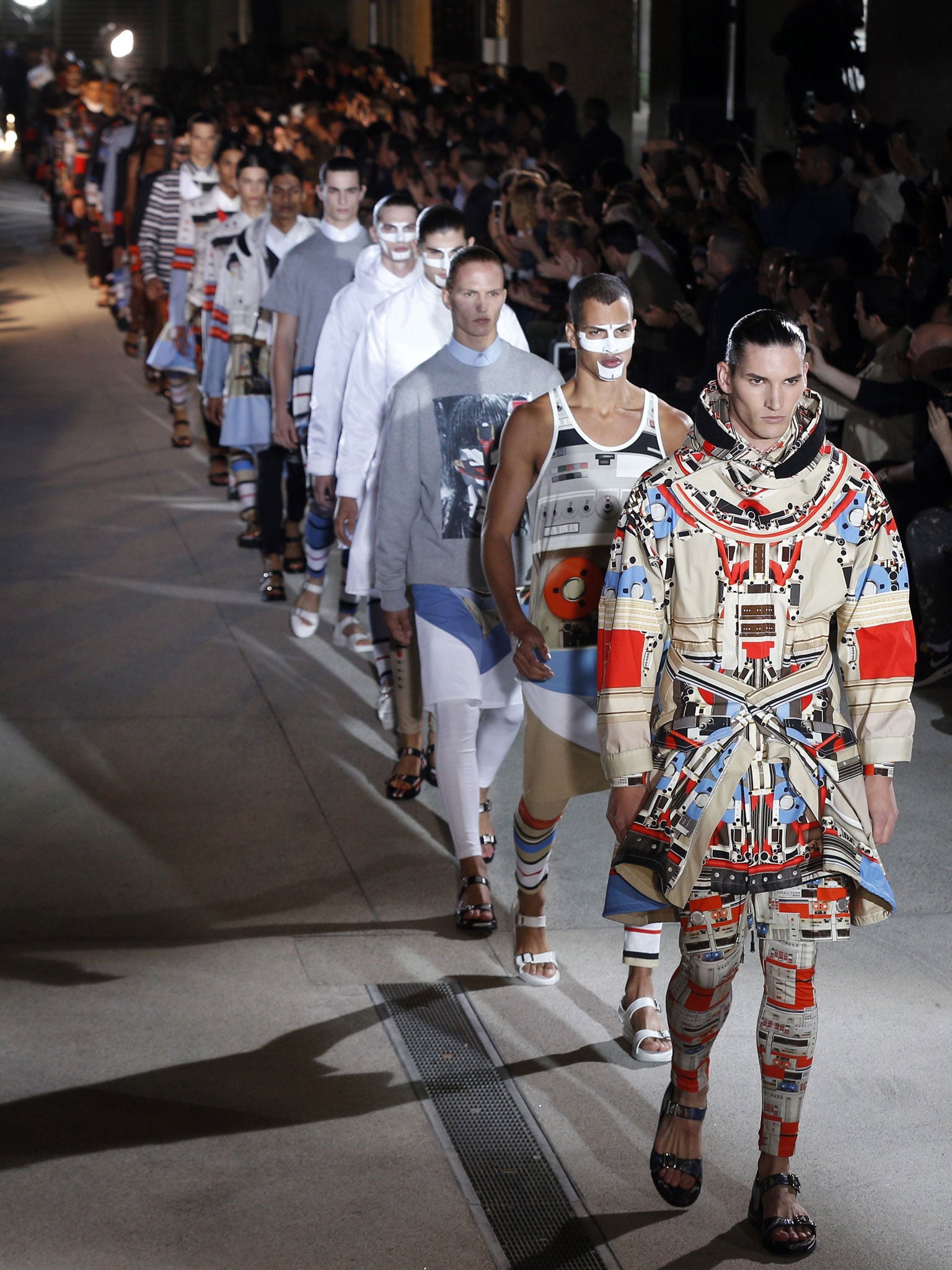 Models presents a creation from the Spring/Summer 2014 Men's Collection by Givenchy fashion house during the Paris Fashion Week