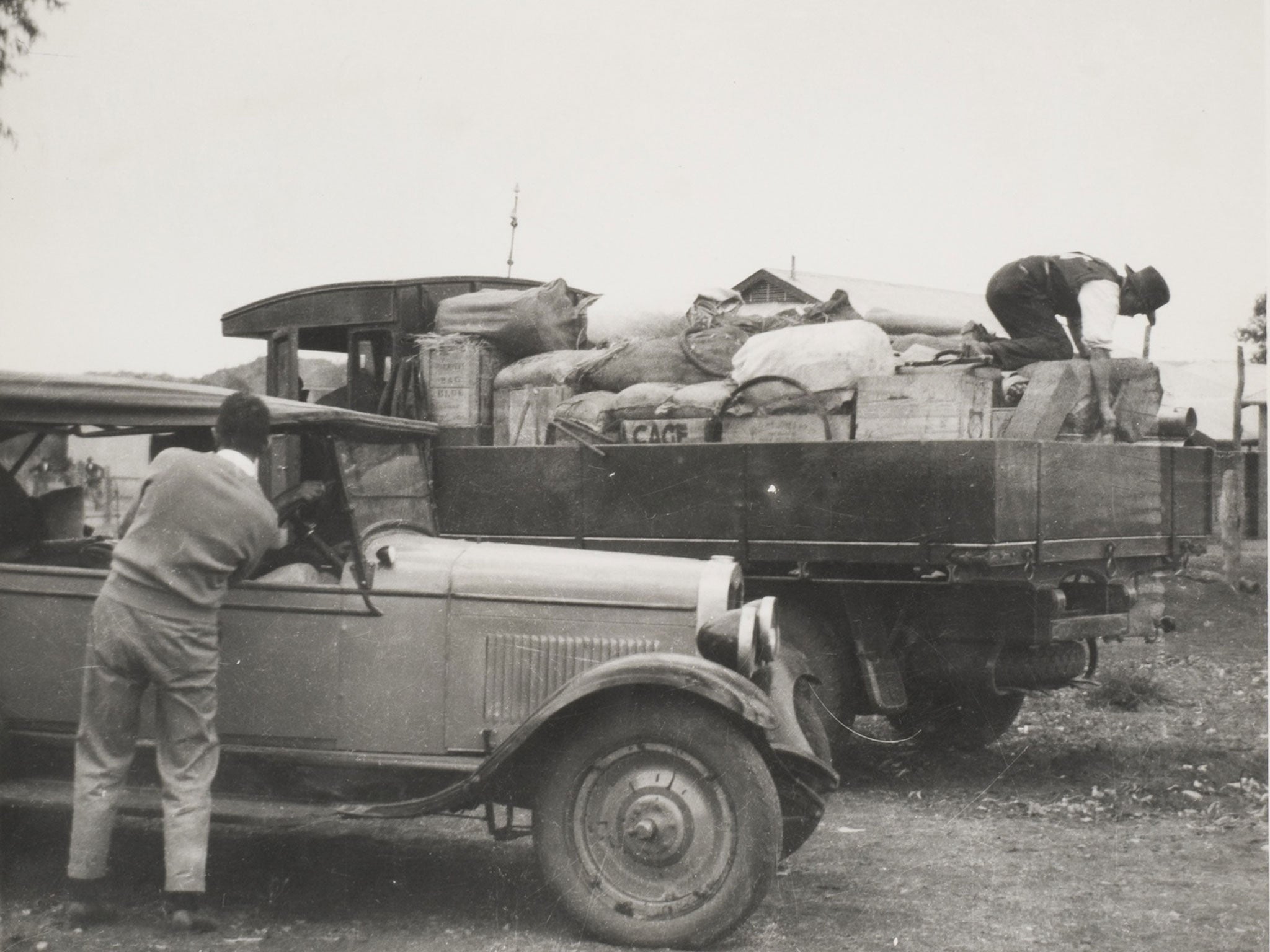 Harold Bell Lasseter, seen right on a truck in Alice Springs in 1930, after finding nuggets ‘as big as plums’