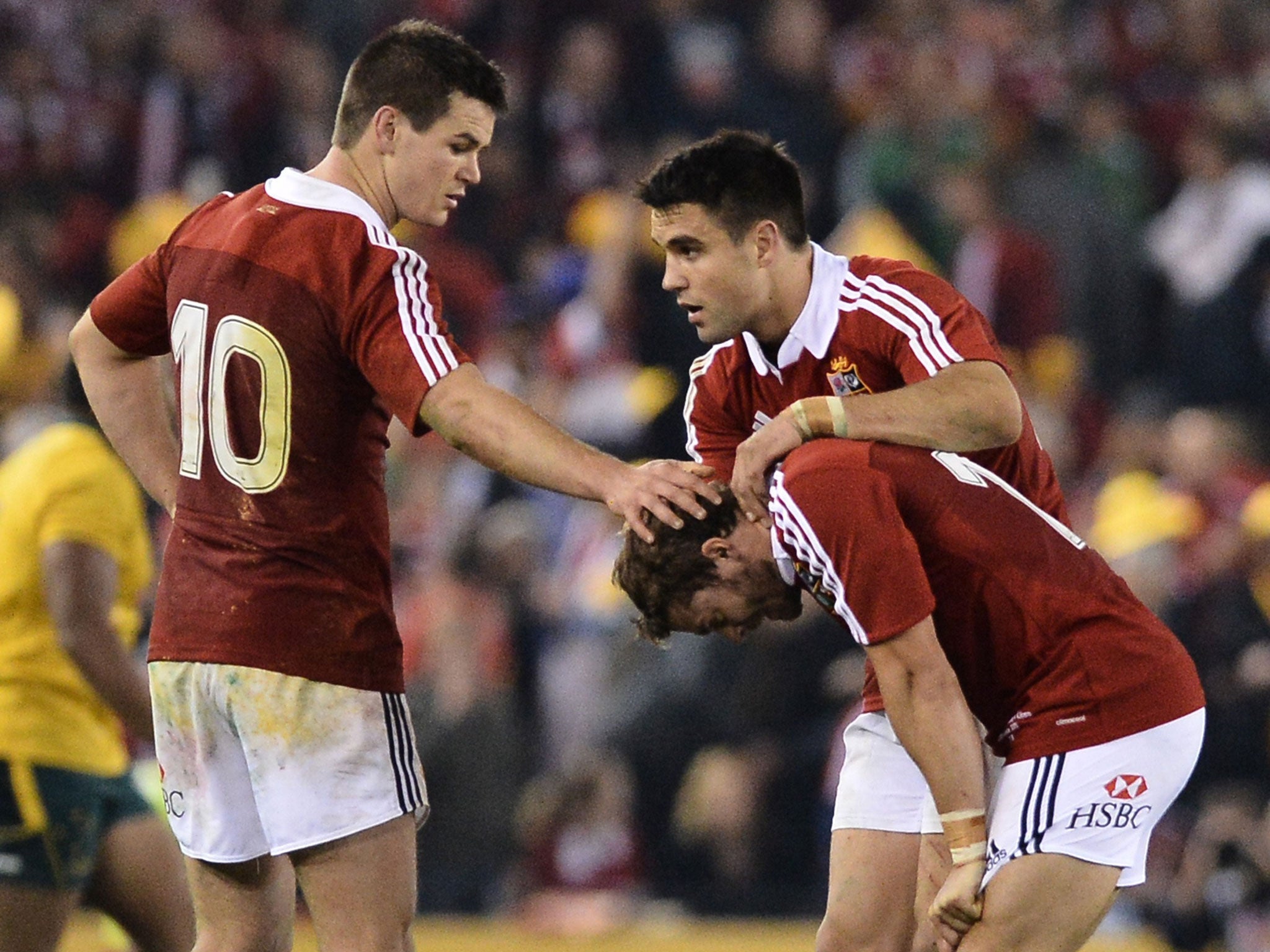 Lion heart: Leigh Halfpenny is consoled by team-mates after his last-second penalty falls agonisingly short