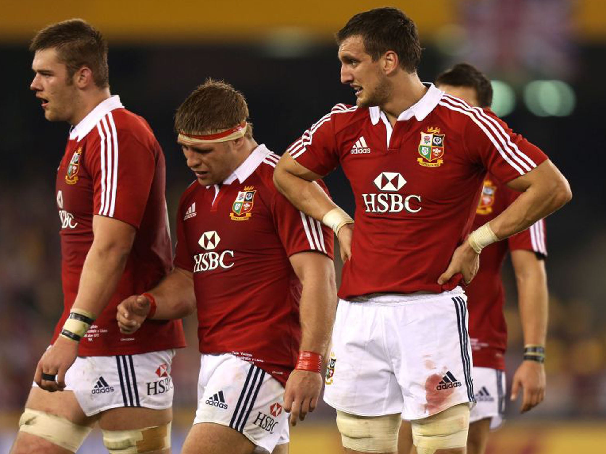 Lions', from right to left, Sam Warburton, Tom Youngs and Dan Lydiate look dejected after the Austrailians kick a penalty