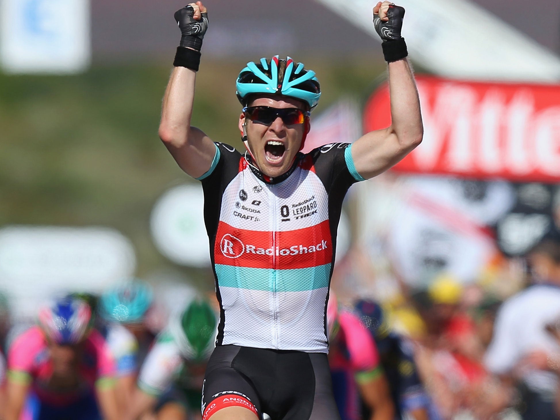 Victory: Jan Bakelants clenches his fists as he celebrates taking stage two of the 2013 Tour De France