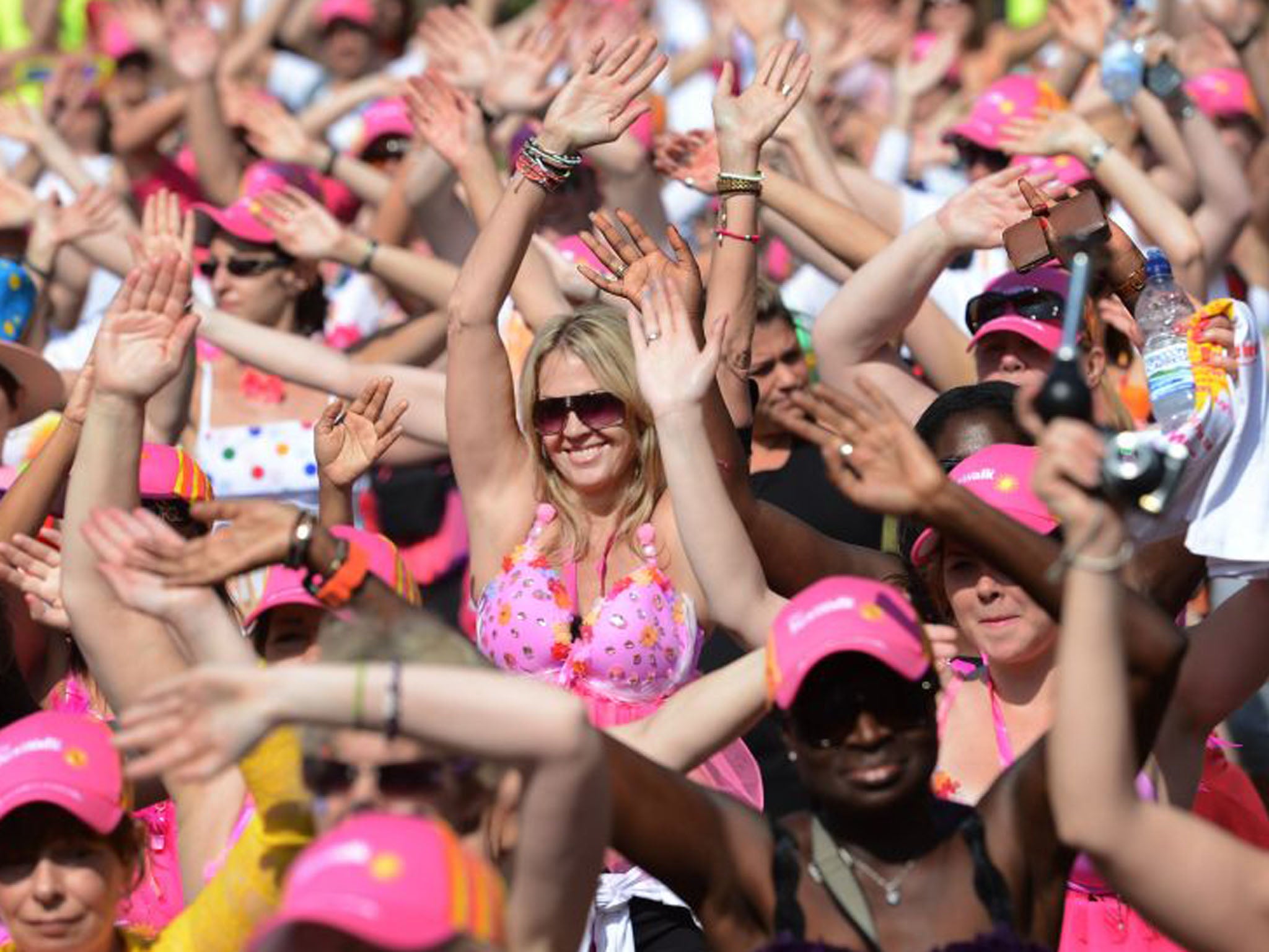 30 June 2013: Charity walkers take part in the SunWalk for breast cancer charity Walk the Walk, through Battersea Park, London (Stefan Rousseau/PA)