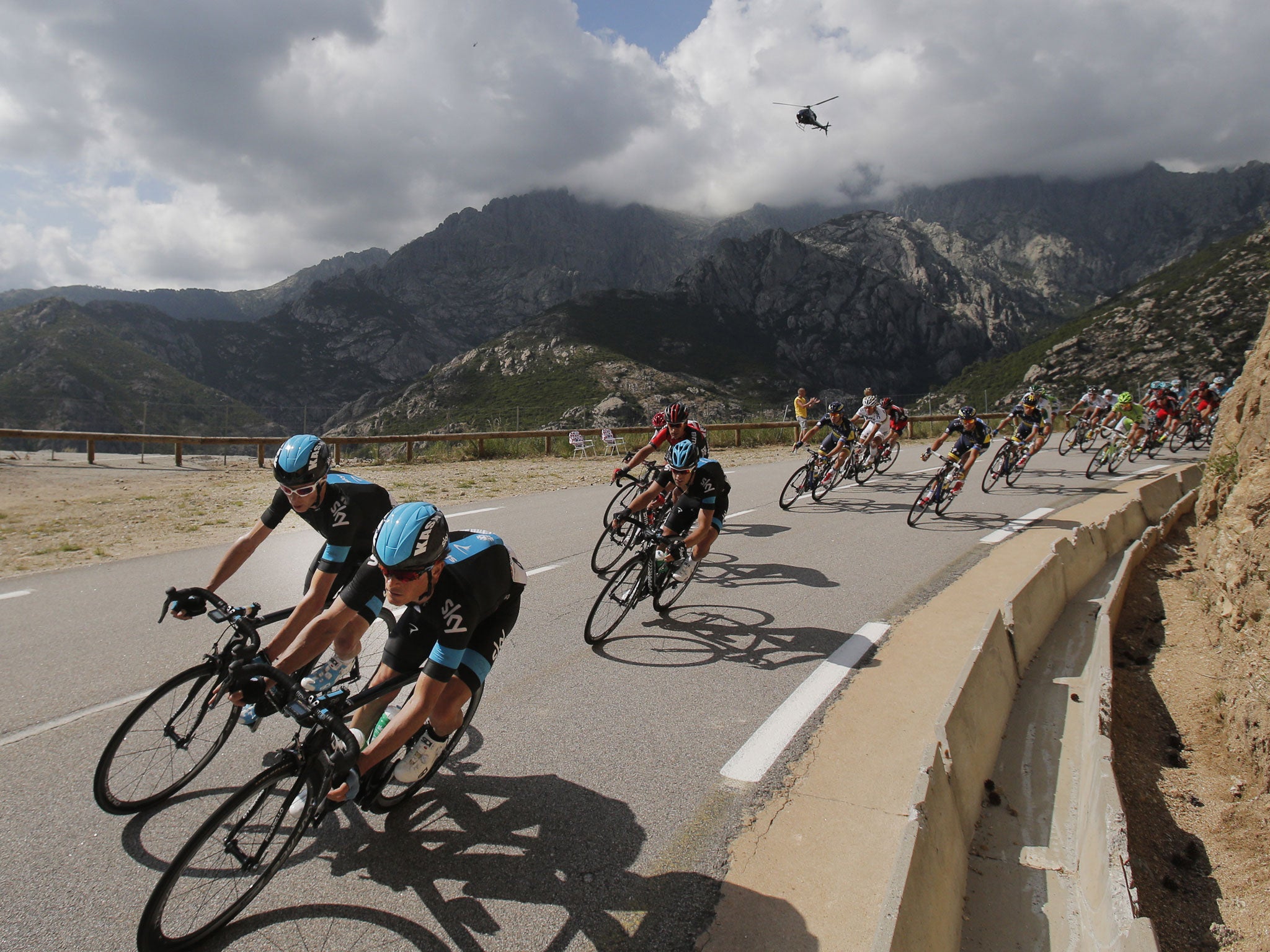 Team Sky’s Vasili Kiryienka, right, and Chris Froome, left, lead during stage two yesterday