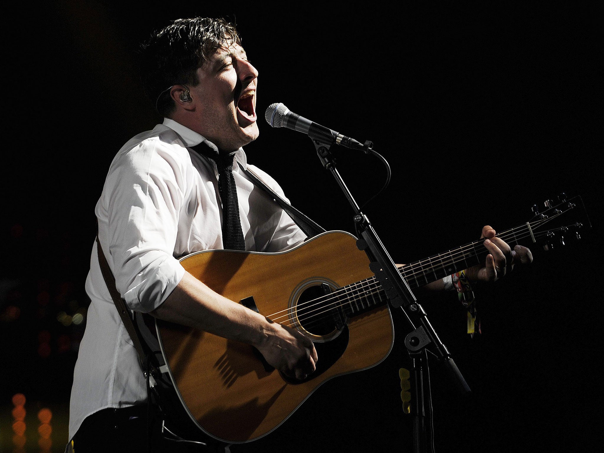 Marcus Mumford performs during a concert at Glastonbury Festival