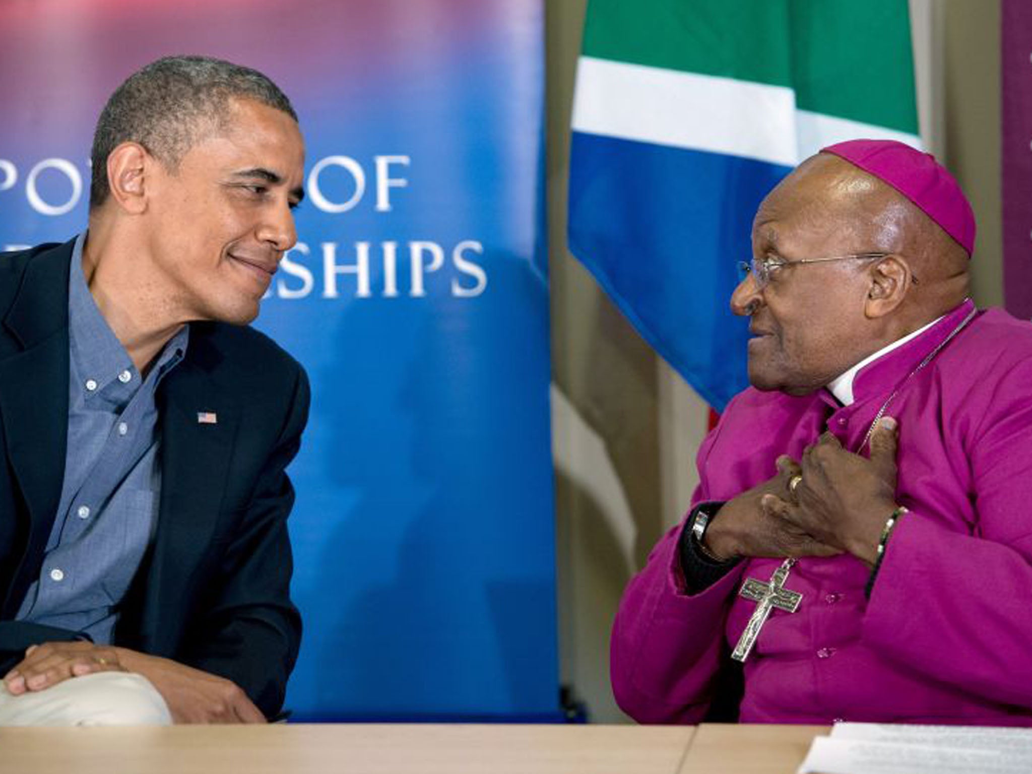 Desmond Tutu, right, speaks alongside President Obama following a tour of the Desmond Tutu HIV Foundation Youth Centre in Cape Town