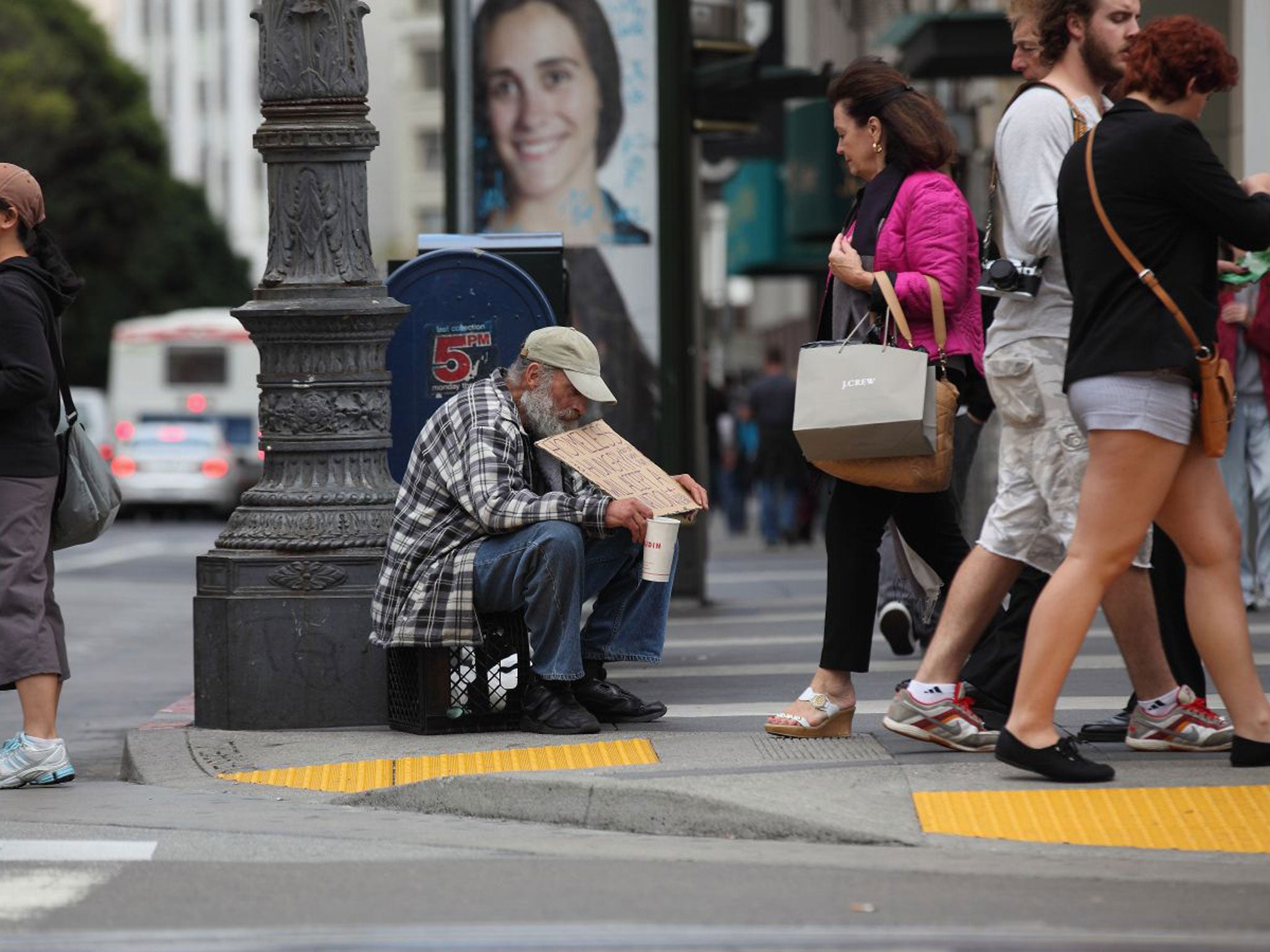 A man panhandles for change