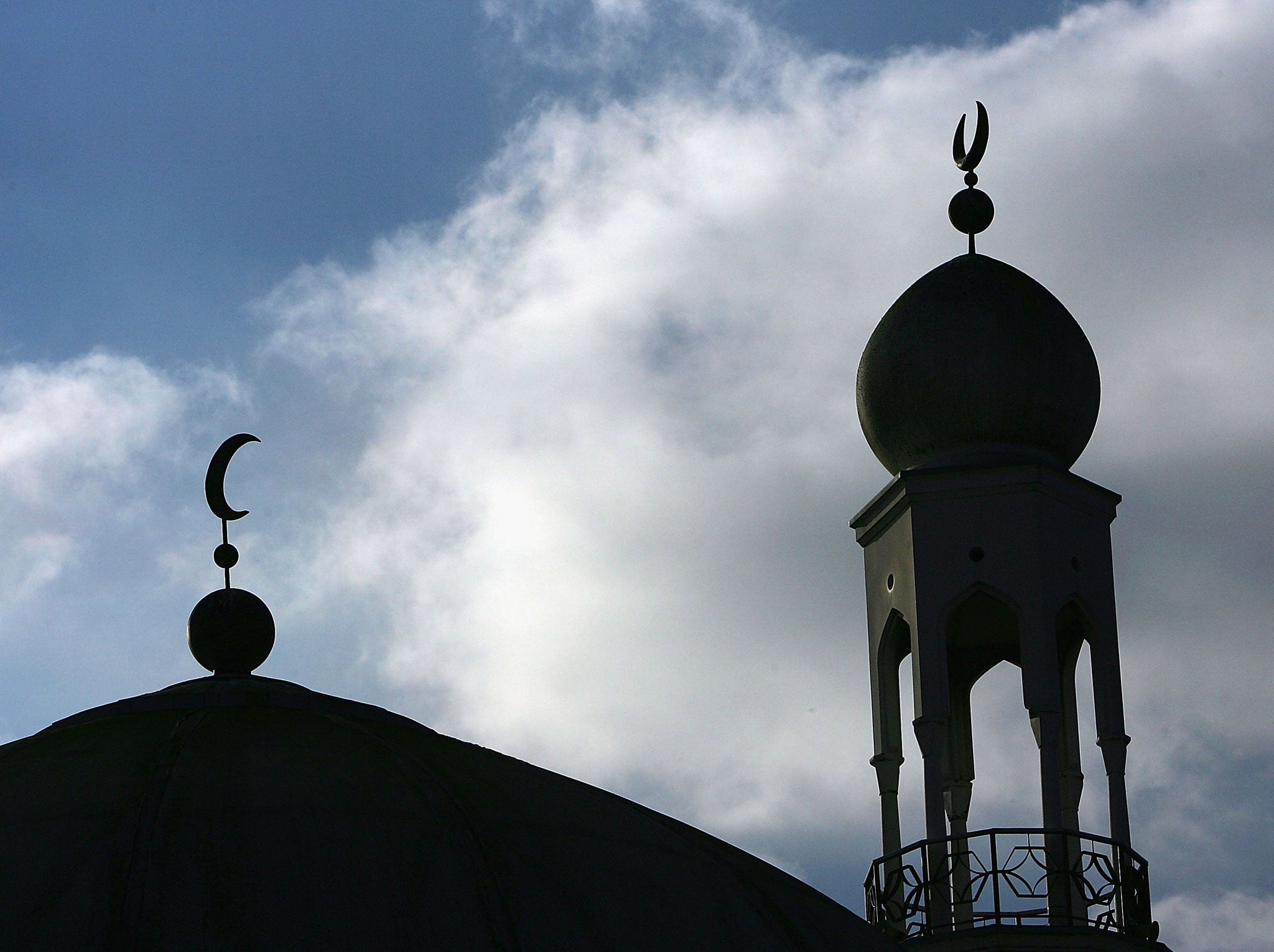 The minaret and dome of the Birmingham Central Mosque dominate the skyline as Muslims arrive for friday prayers on 2 February, 2007, Birmingham, England.