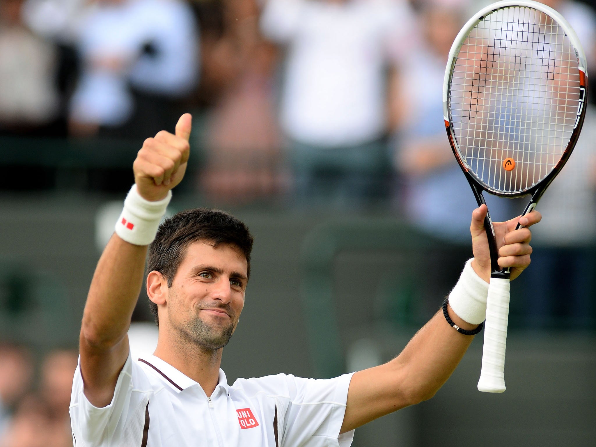 Novak Djokovic celebrates reaching the semi-finals