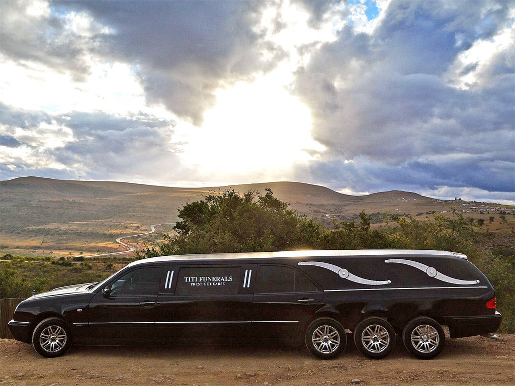 A hearse is pictured at Mvezo resort after being accompanied by a police convoy to collect the remains of former South African President Nelson Mandela's children
