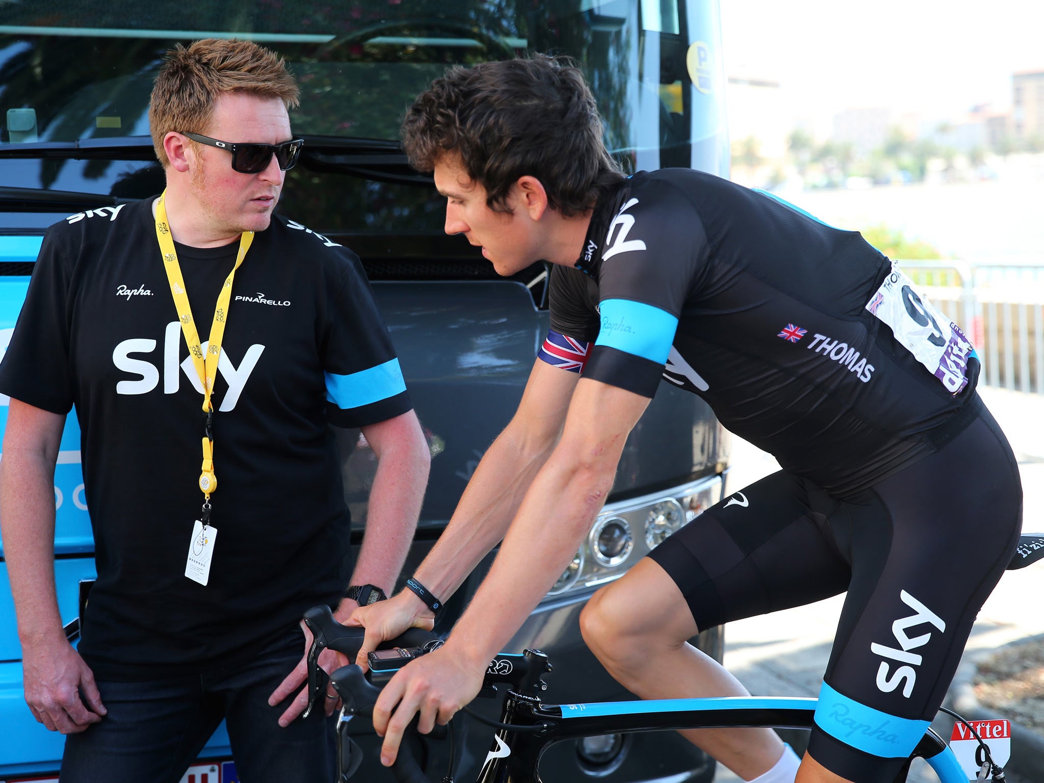 Geraint Thomas of Great Britain and Team Sky (R) talks to Team Sky coach Rod Ellingworth