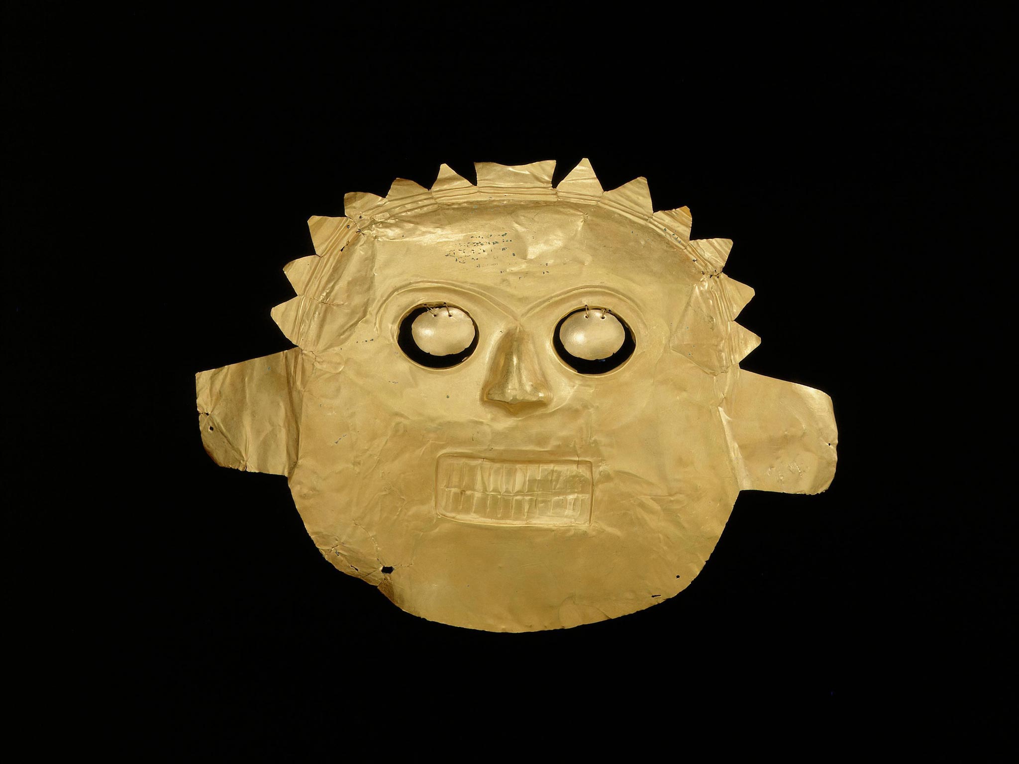 A funerary mask, Calima-Malagana made of gold alloy dated from around 100BC-AD400, part of the British Museum's autumn exhibition, Beyond El Dorado: power and gold in ancient Colombia