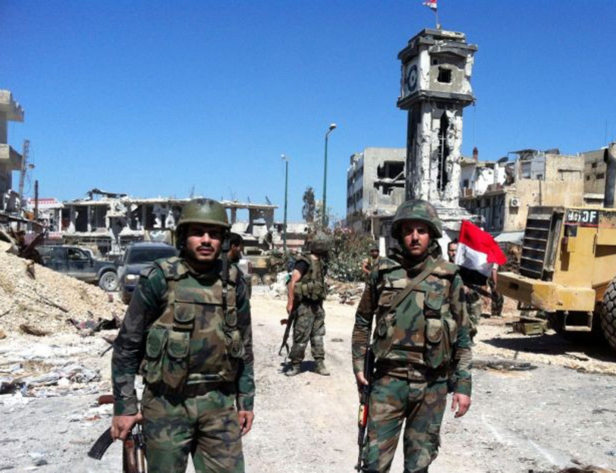 Syrian government soldiers in the main square of the city of Qusayr, near the Lebanese border