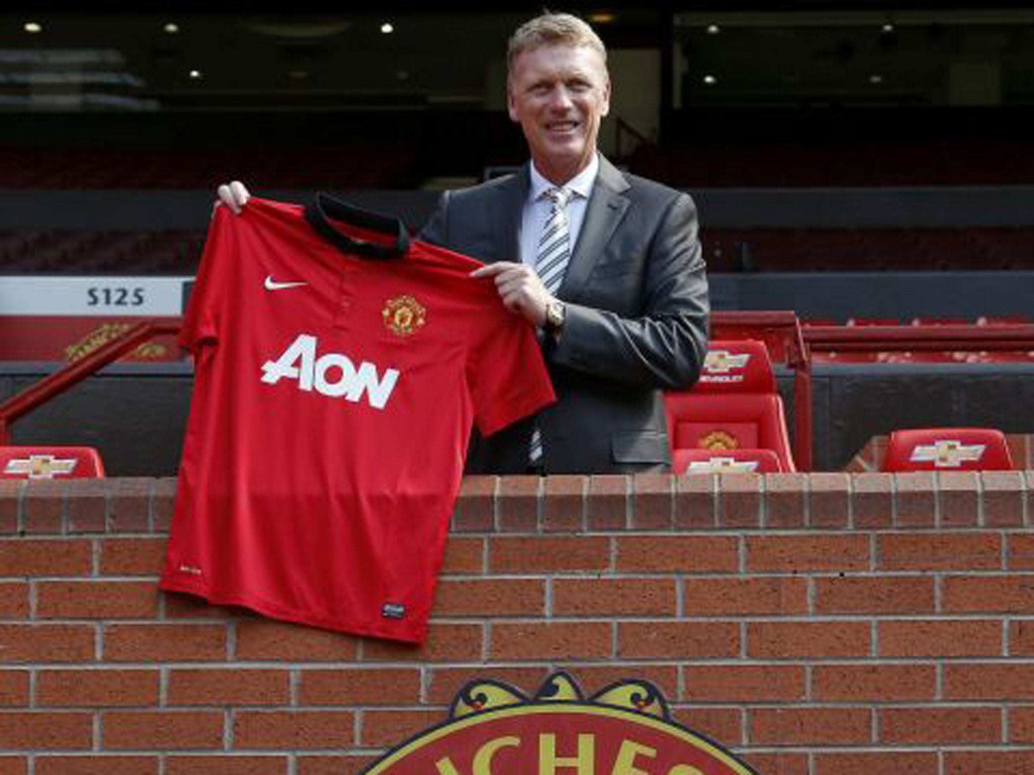 David Moyes poses near the home dugout at Old Trafford