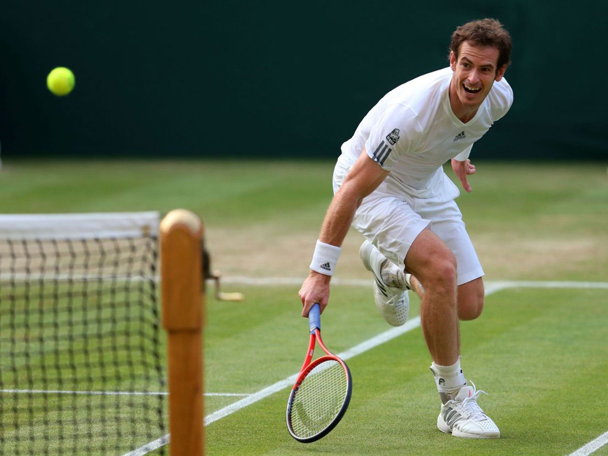 Andy Murray stretches to return the ball during his victory on Centre Court