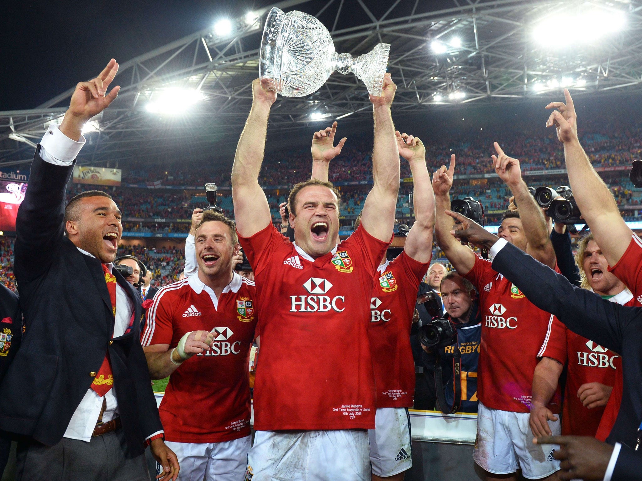 Top glass: Jamie Roberts lifts the trophy and celebrates the series victory against Australia