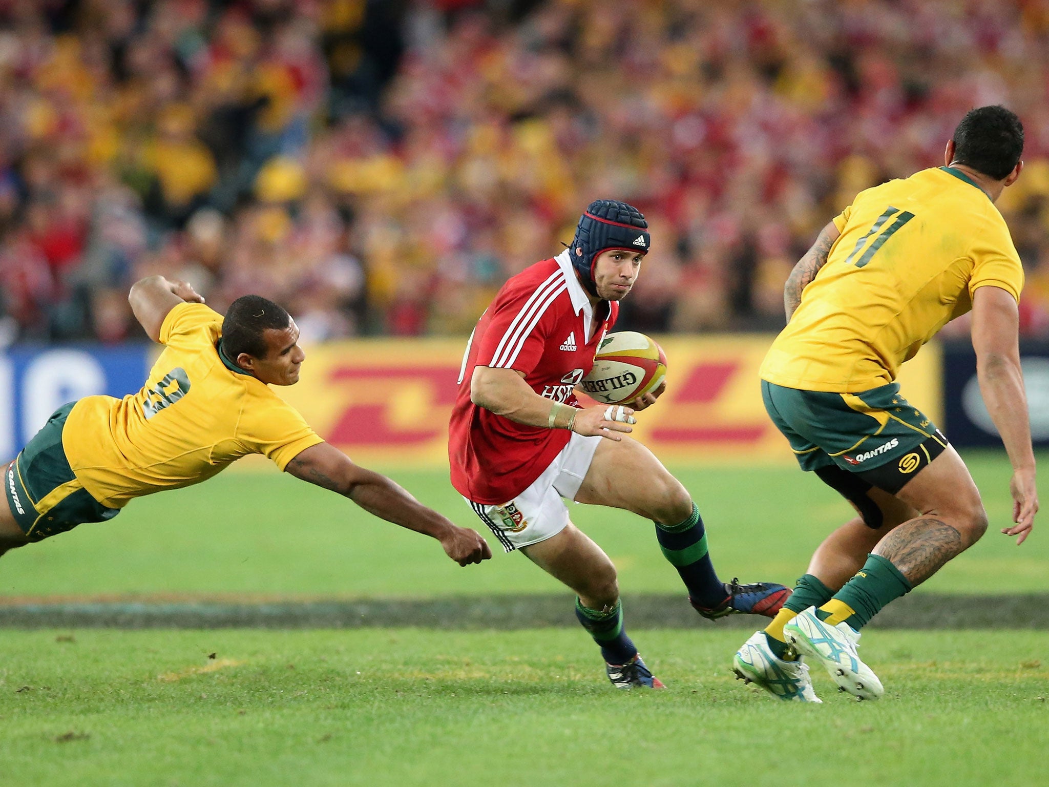 Step aside: Leigh Halfpenny beats Will Genia and Joe Tomane to set up a try