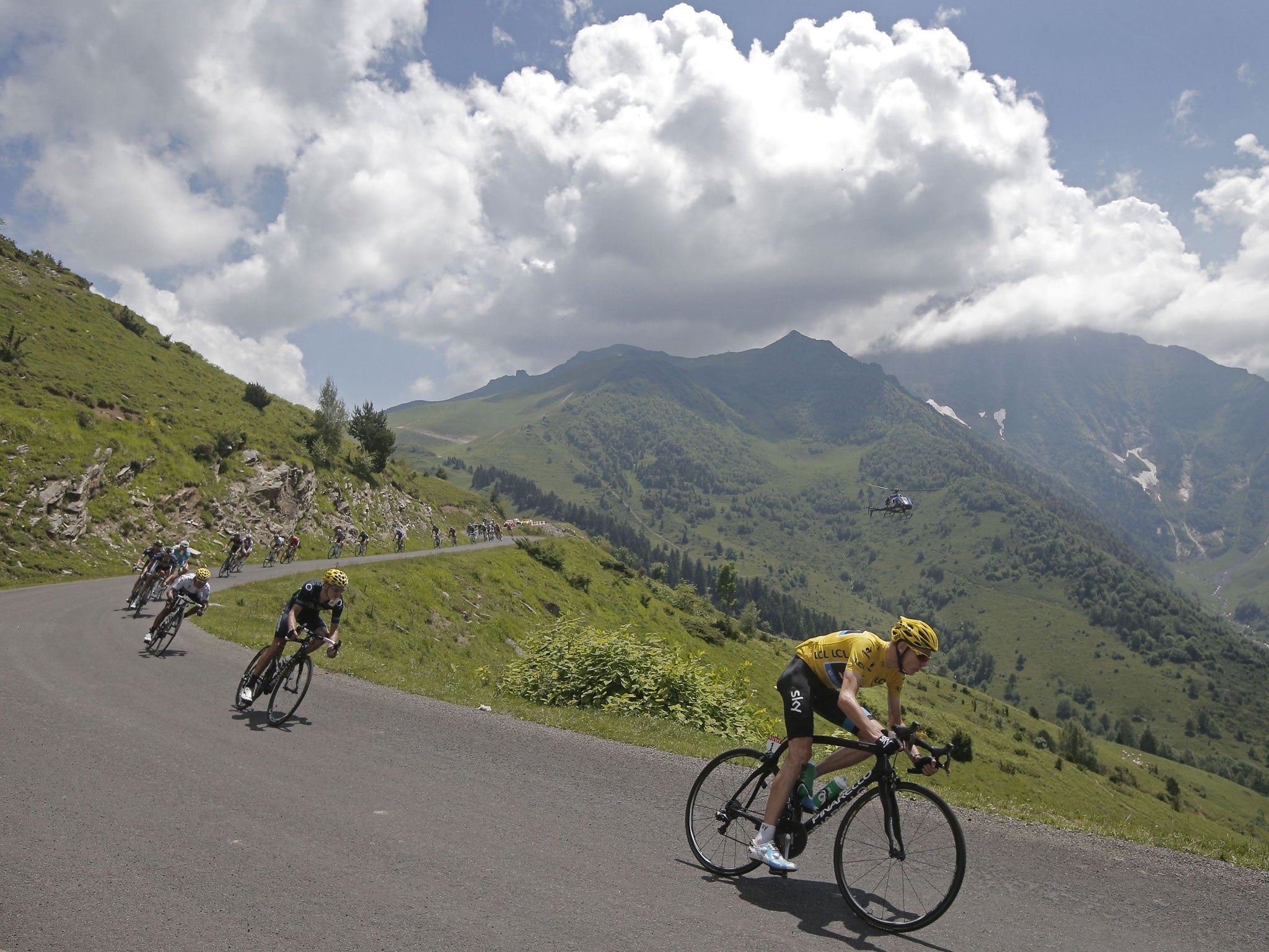 Chris Froome, wearing the yellow jersey, speeds down the Val Louron-Azet pass