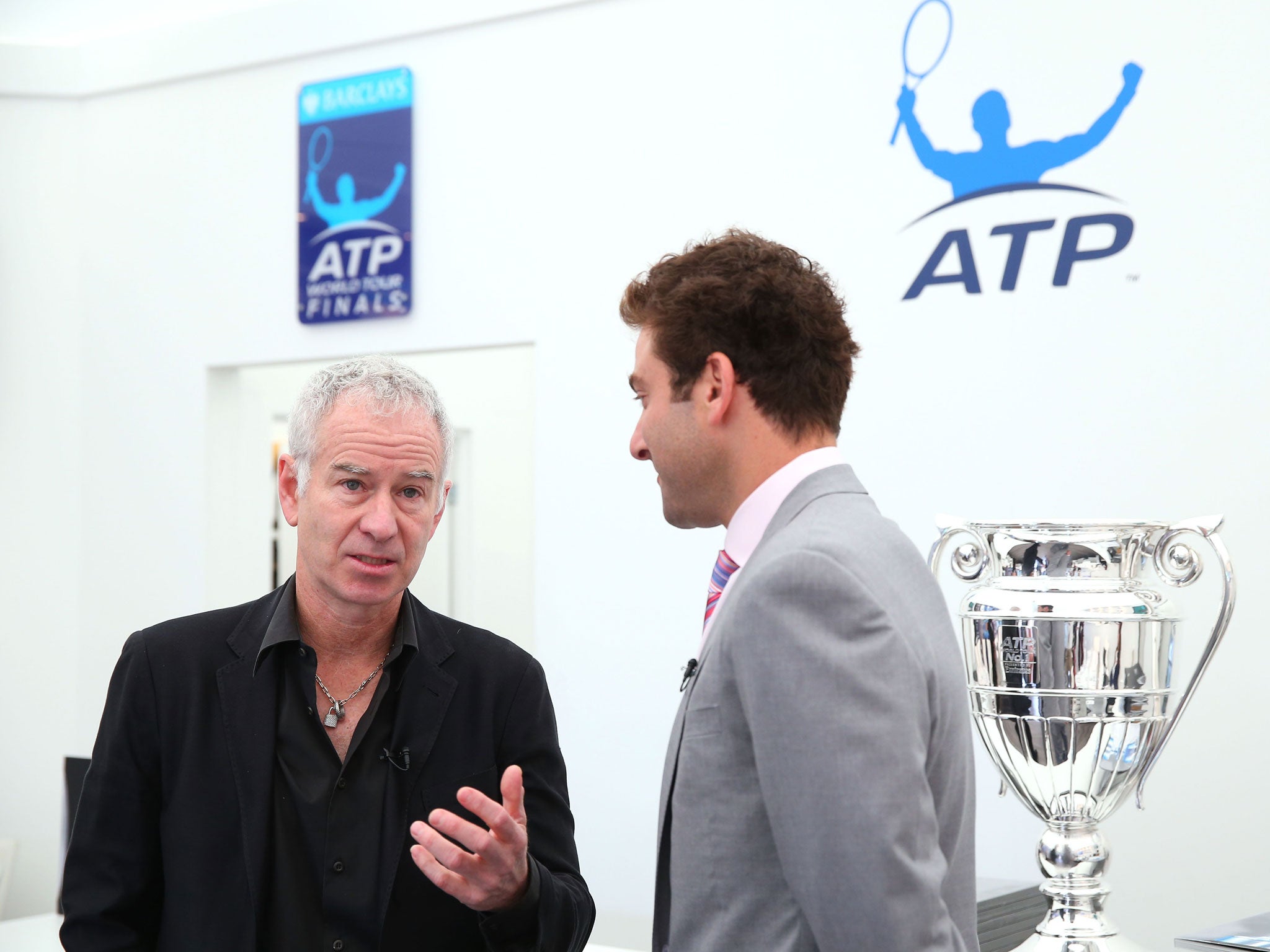 Perhaps John McEnroe, left, was indulging Court One with some more knockabout veteran doubles