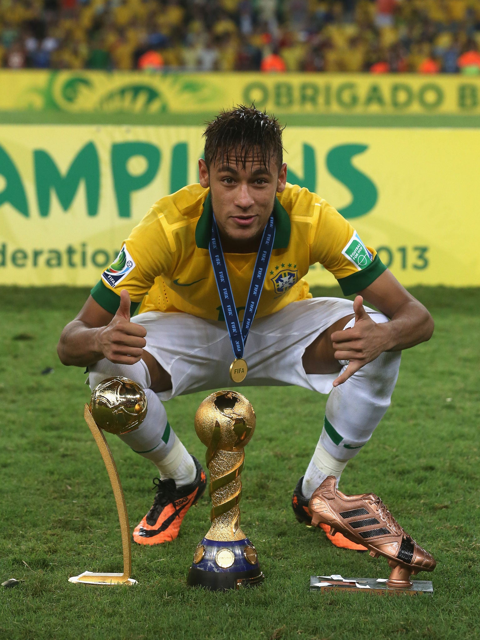 Neymar lines up the trophies after Brazil defeated Spain to win the Confederations Cup in Rio de Janeiro