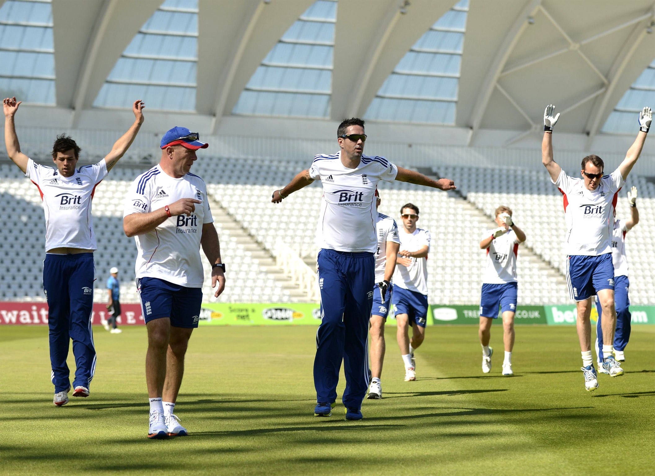 Kevin Pietersen (third left) warms up with his England teammates
