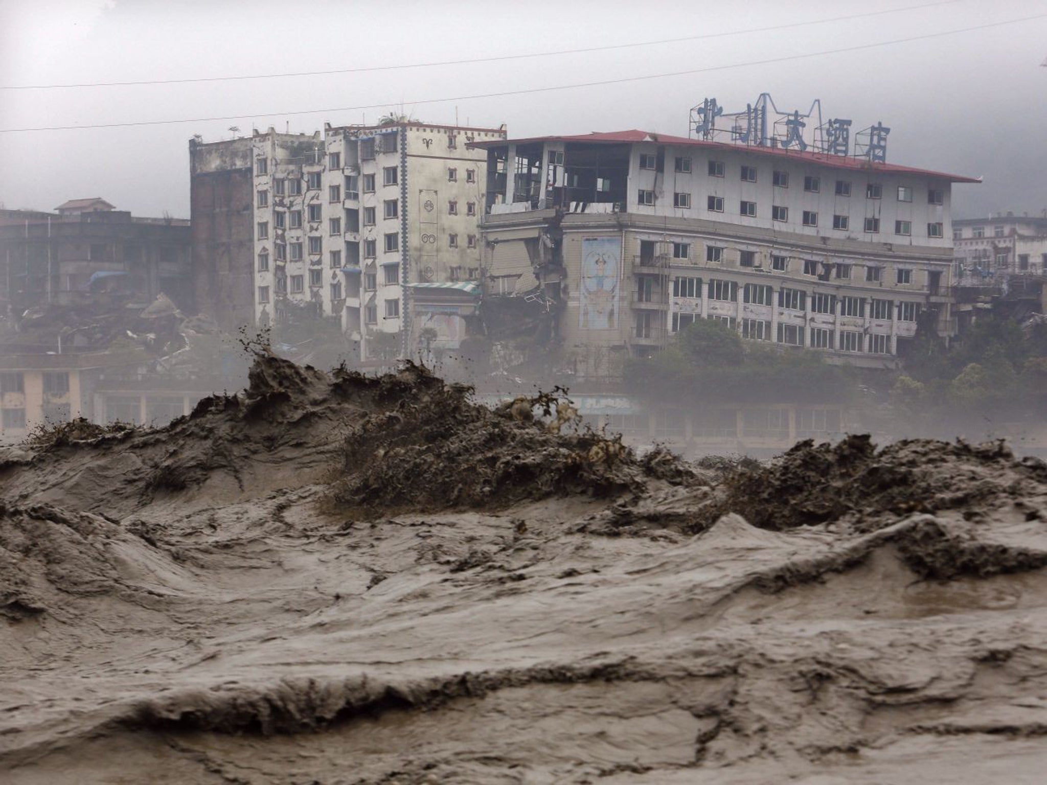 Heavy flood waters sweeping through Beichuan in southwest China's Sichuan province