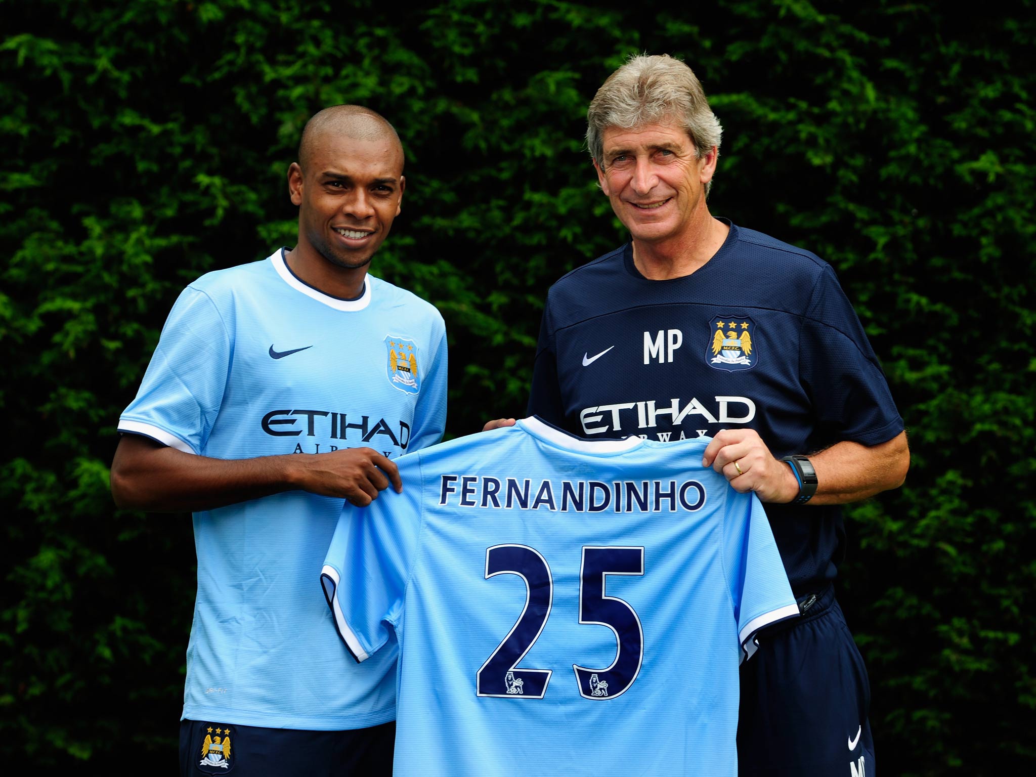 Fernandinho alongside Manuel Pellegrini