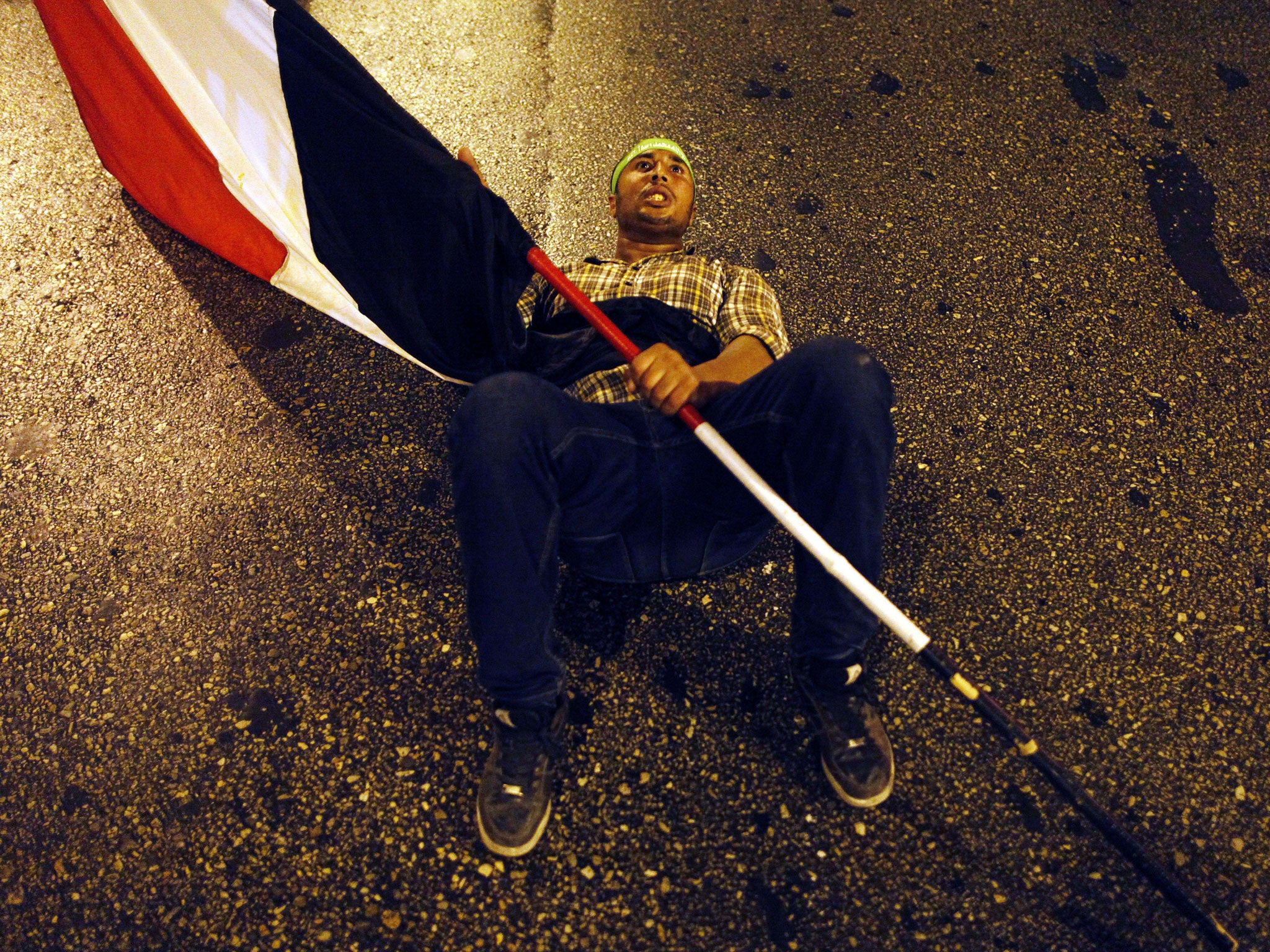 Down, not out: A supporter of the ousted Mohamed Morsi in Cairo