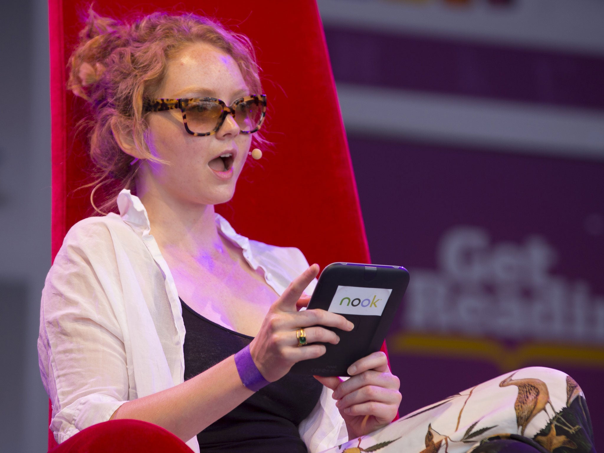 Lily Cole reads on stage
